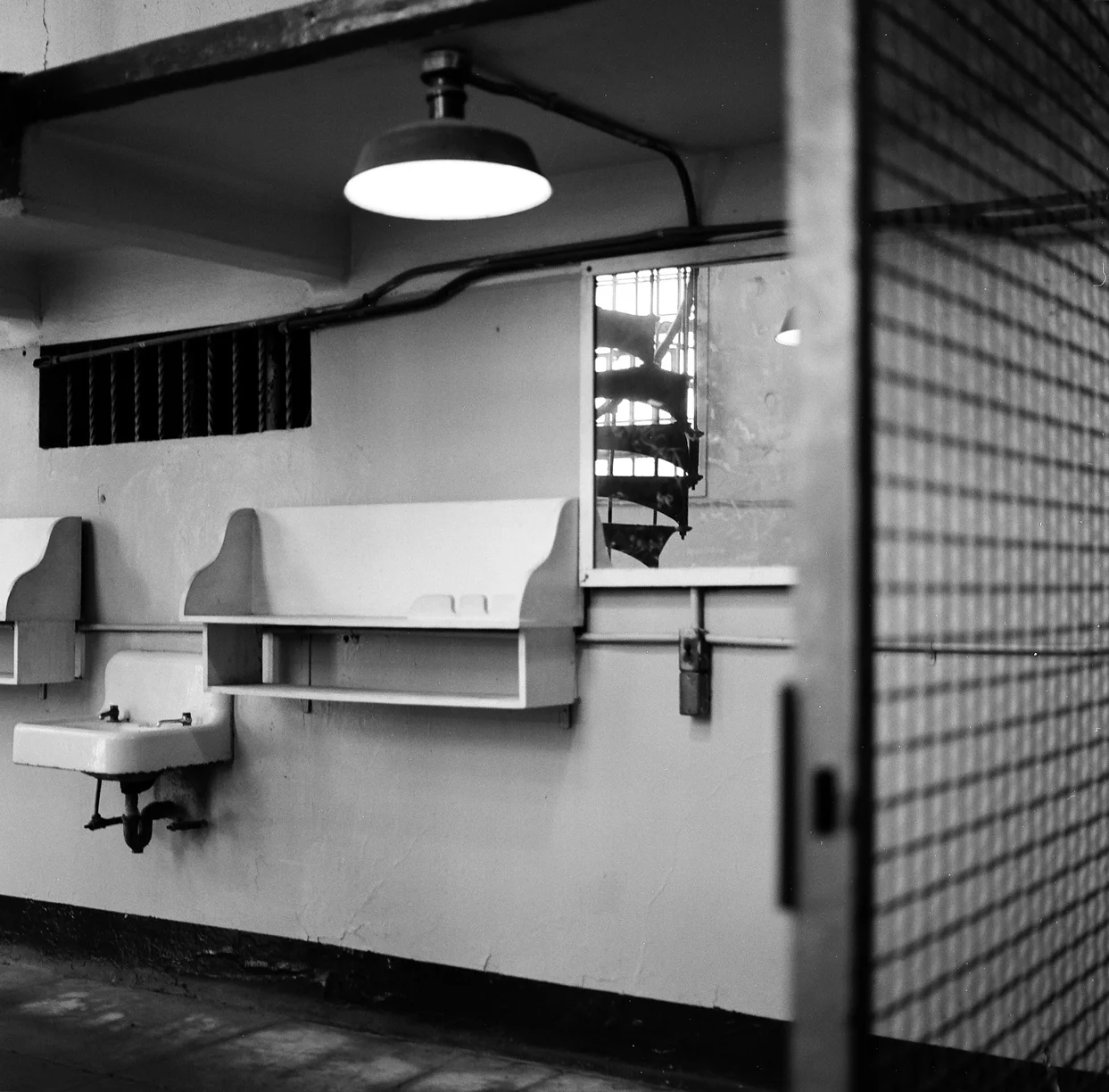 Sink and Stairwell Reflected in Mirror_Gate_Alcatraz_web.jpg