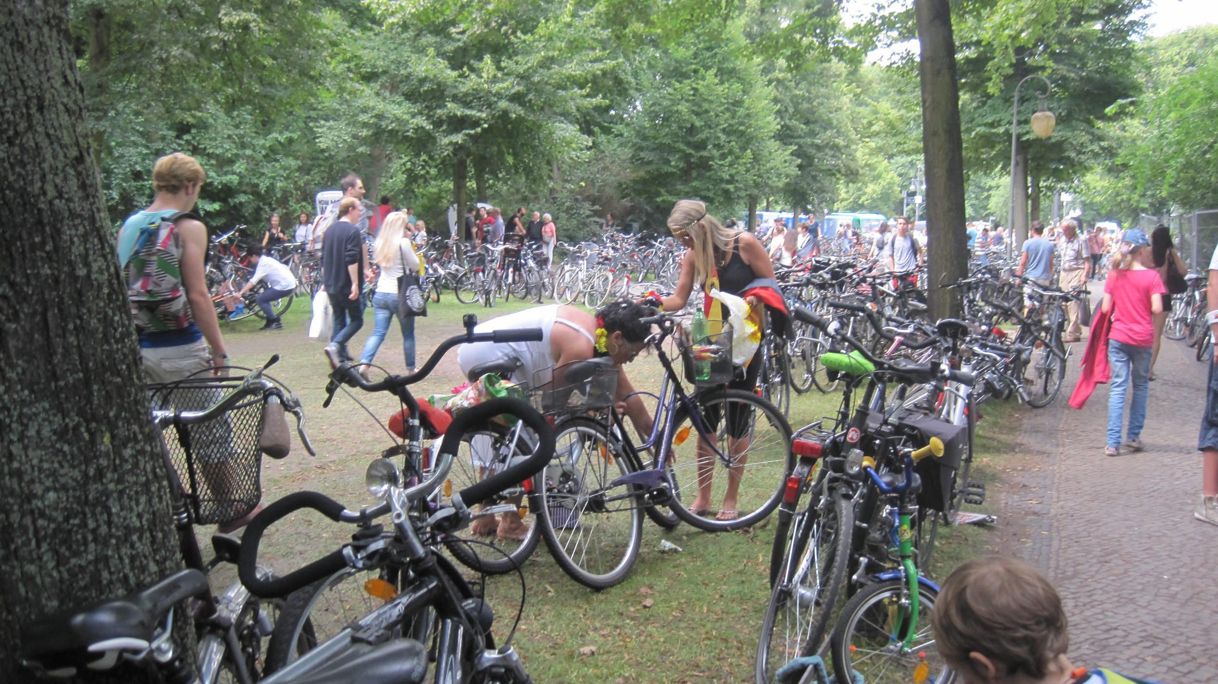Germany soccer fans came by foot, bike and transit to join in the massive World Cup celebration at Bradenburg Tor. It was an amazing time to be in Berlin to see soccer mania and the prevalent use of bikes across the city. (Photo: M. Zimmerman, July 2014)