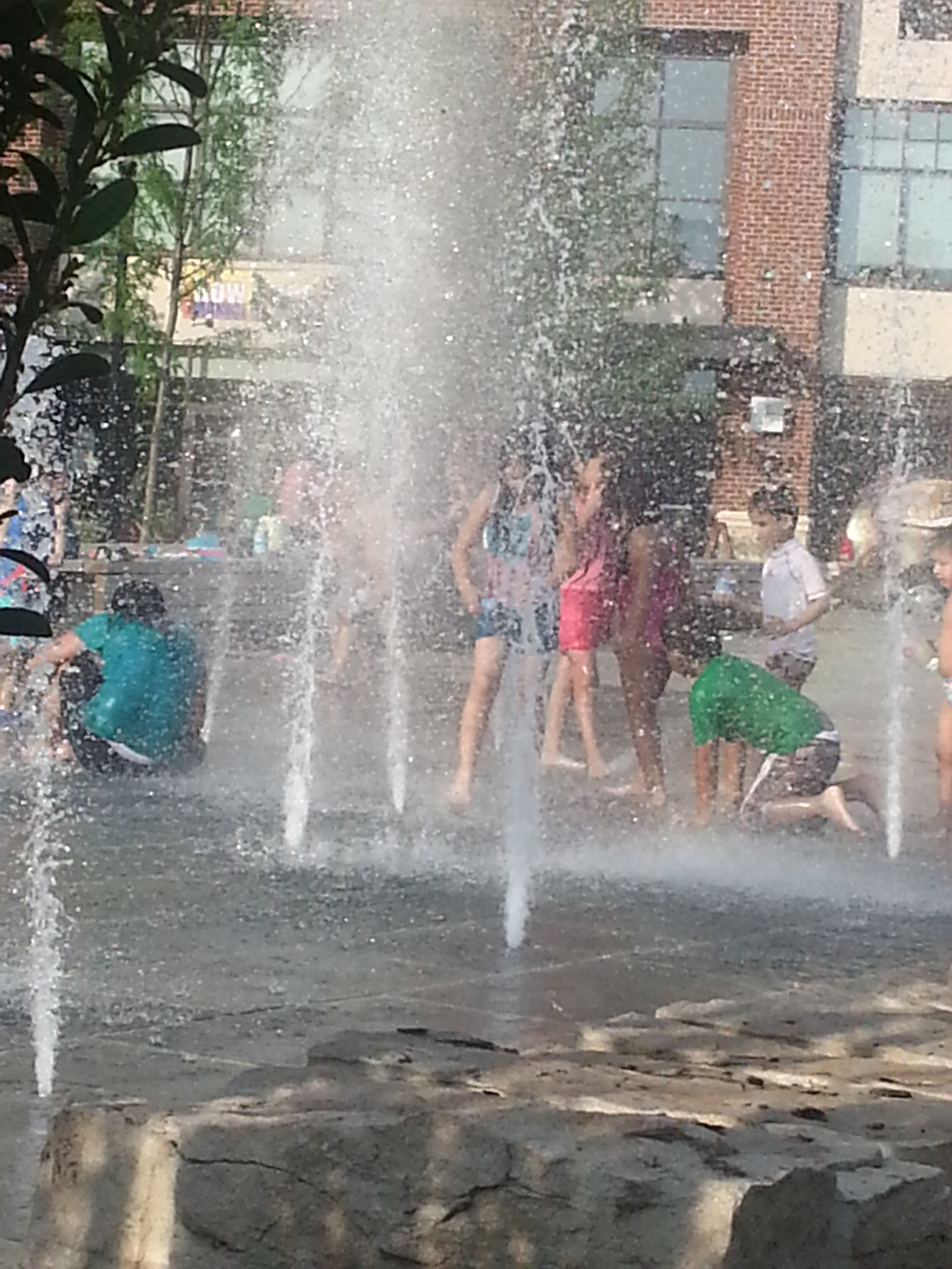 "Spraygrounds" like this one along Arlington VA's Colombia Pike are great examples of the kinds of active and multi-generational public space that makes for a complete community. This one is even transit accessible! (Source: M. Zimmerman, 2013)