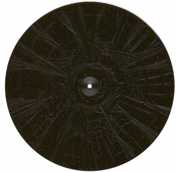 the "non-playable" backside of the vinyl record features a lovely hand etched work by Kutmah.