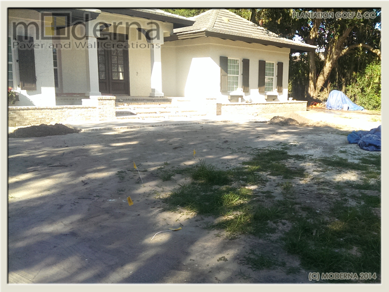 After photo showing the Entry stairs, brick planter walls before the paver driveway construction. 