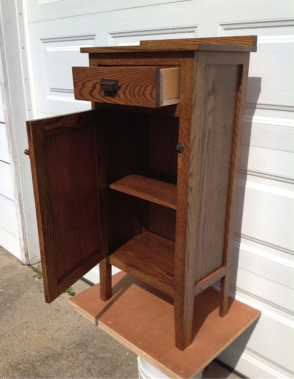 Oak storage cabinet with drawer and movable shelf