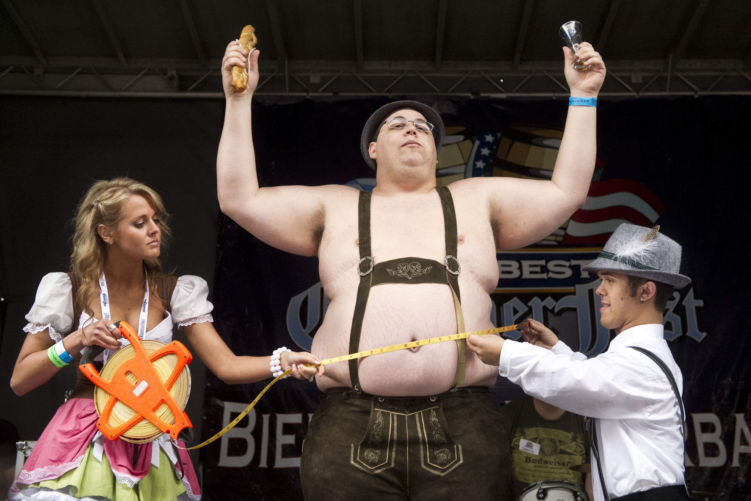 Participants have their stomachs measured in the Beer Belly Contest at Baltimore Beer Week's Das Best Oktoberfest at M&T Bank Stadium in downtown Baltimore. 2013