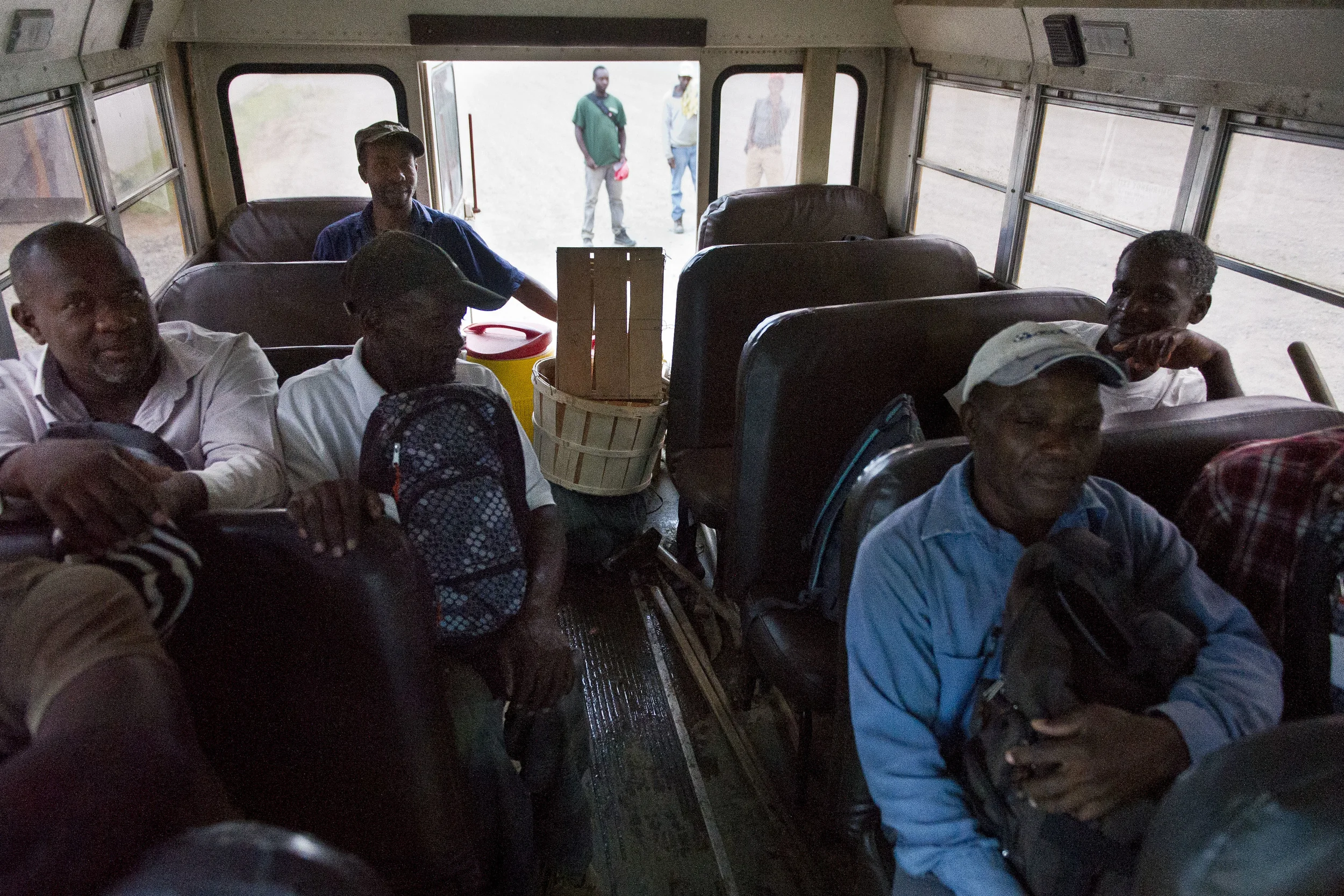 Western Massachusetts migrant workers wait to be bused to area farms for the work day.