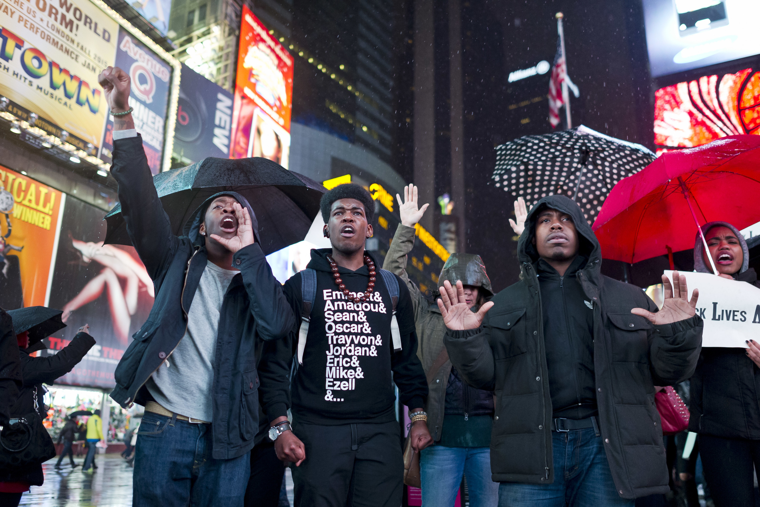  Protestors call for Justice in a rainy Times Square. 