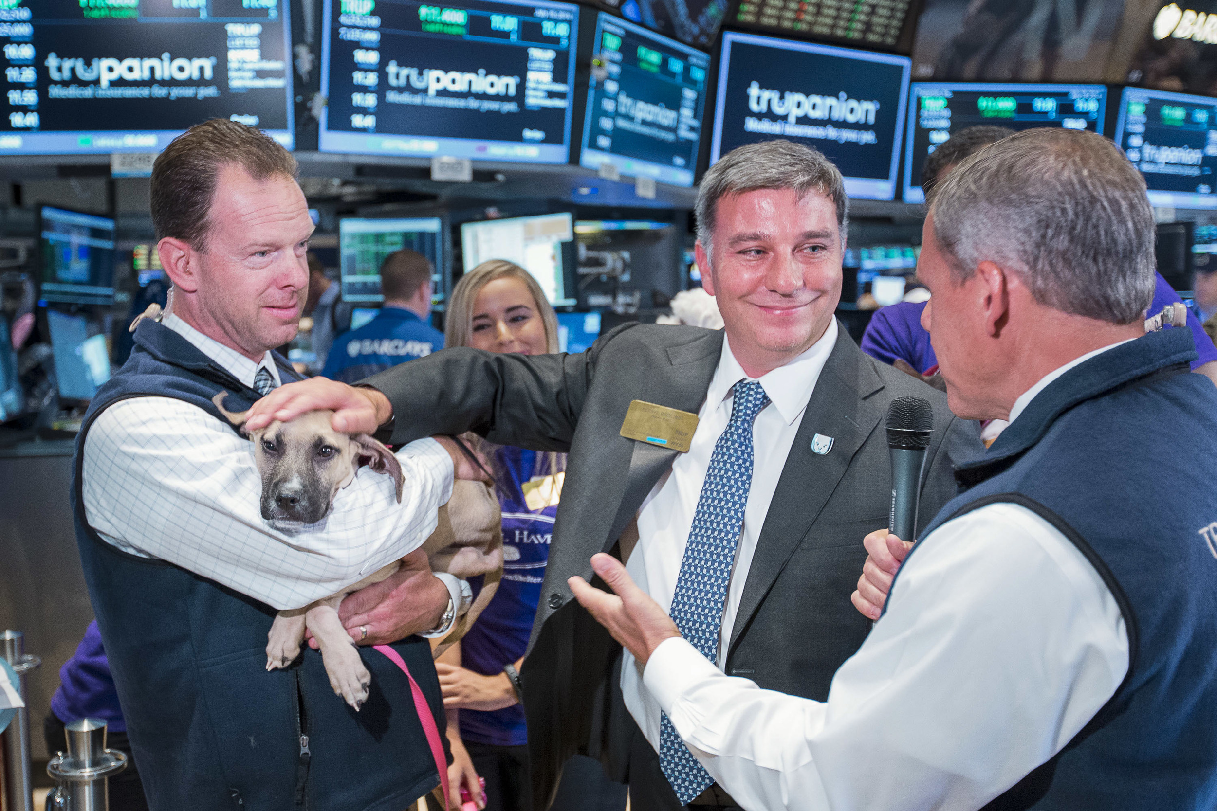 The CEO of a pet healthcare company participates in an interview on the trading floor during an IPO. 