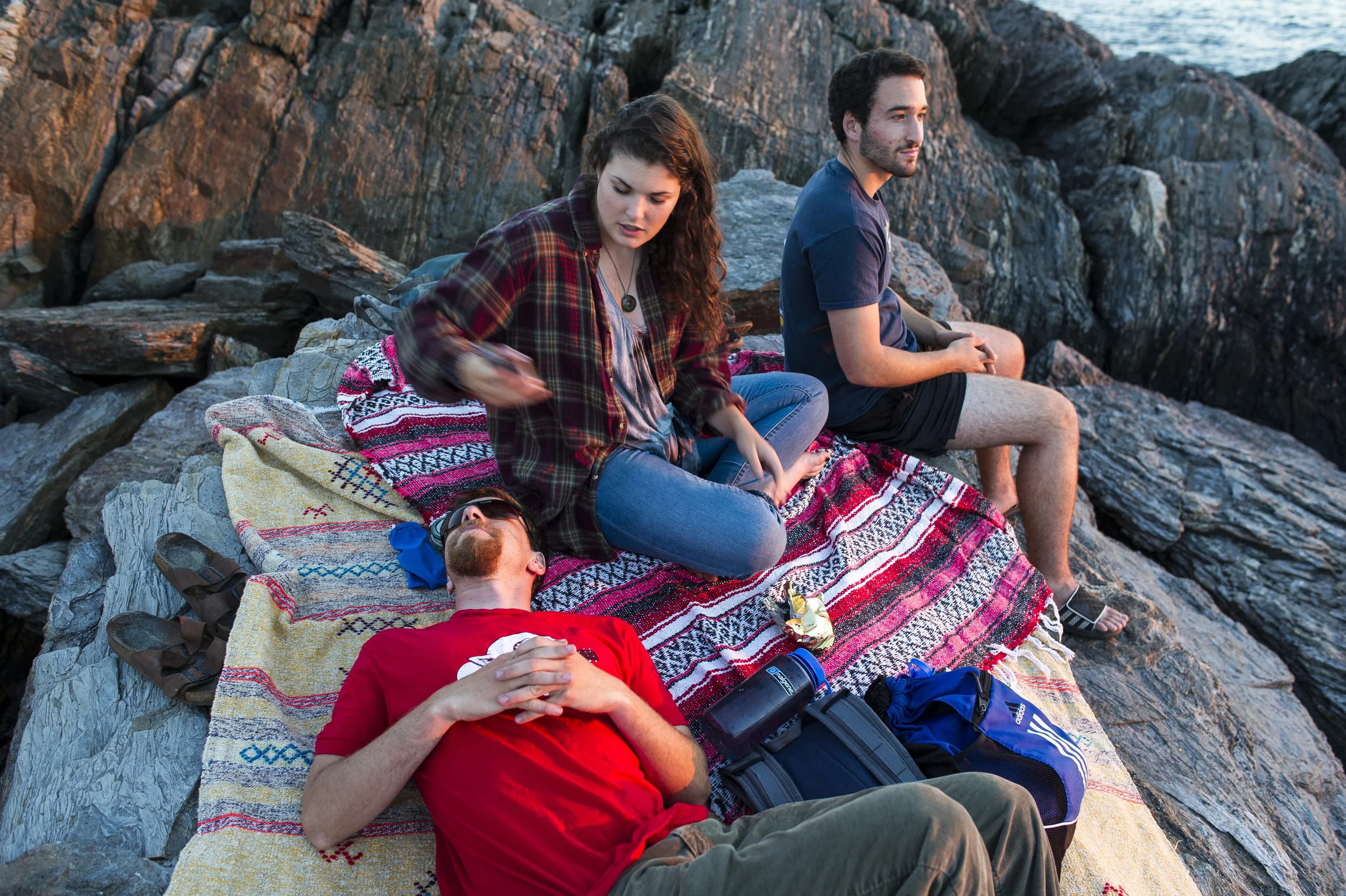 Gunn and Cohen-Kaplan join Adam Auerbach ’16 of Silver Spring, Md. on Hermit Island., about three miles from Shortridge, where they watch the sunset from a spot called the Bath Tub.