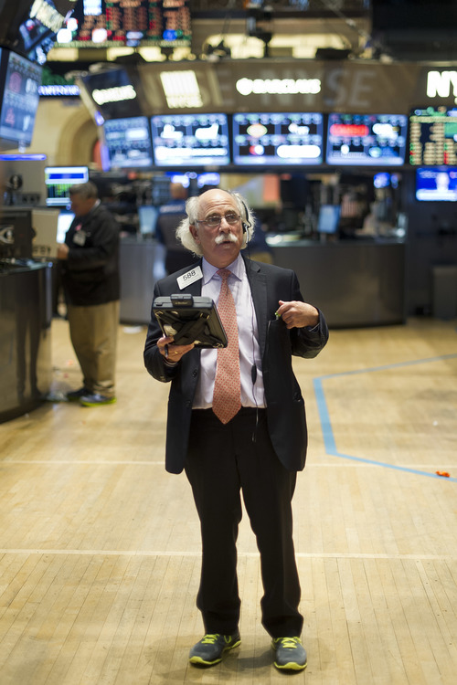 Peter Tuchman, longtime trader at Quattro M. Securities, checks the big board after the Closing Bell. 