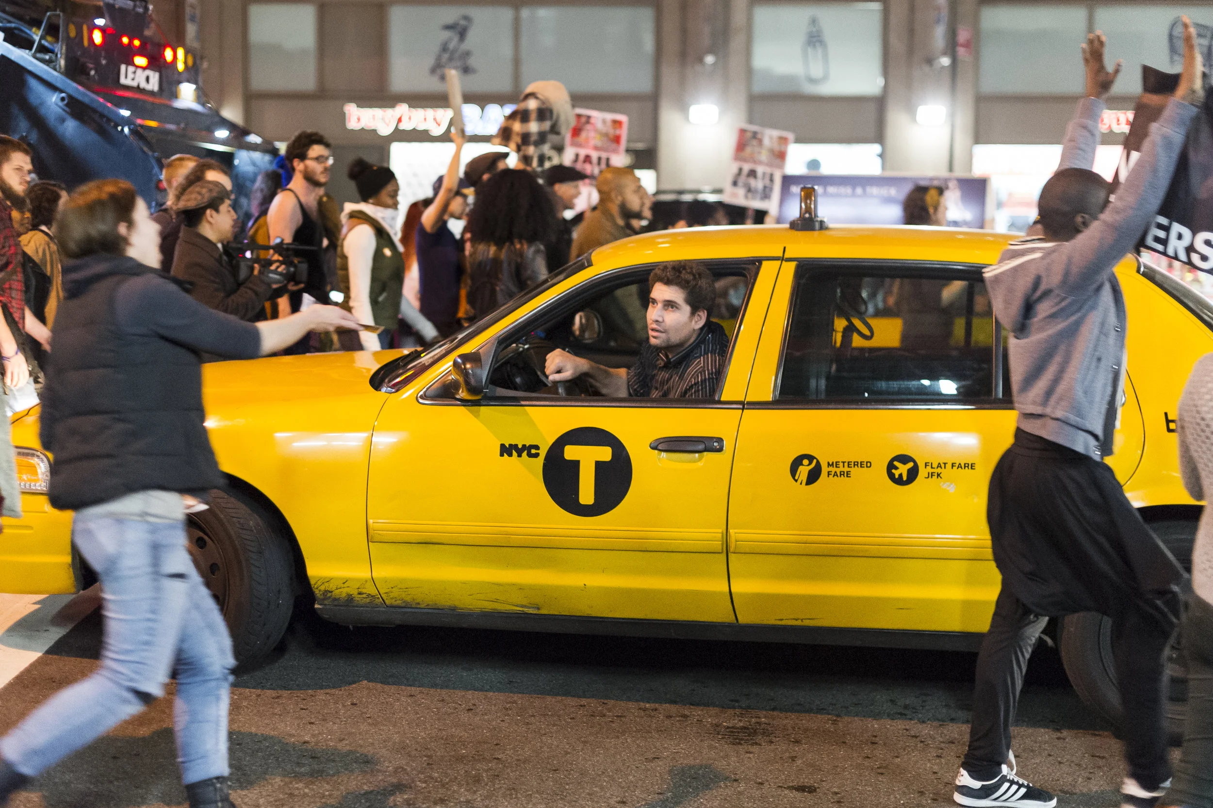 A taxi driver shouts at demonstrators as they block 7th avenue in Manhattan.