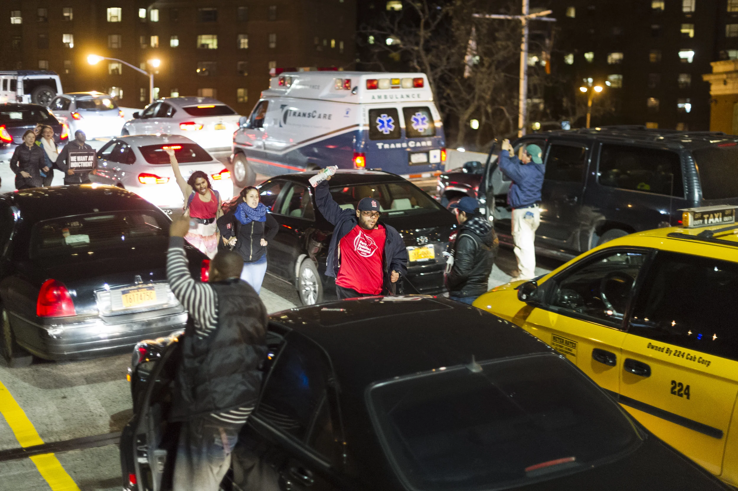 Protestors weave through traffic on FDR Drive on November 25th, 2014 following a St. Louis grand jury's decision to not indict Officer Darren Wilson.