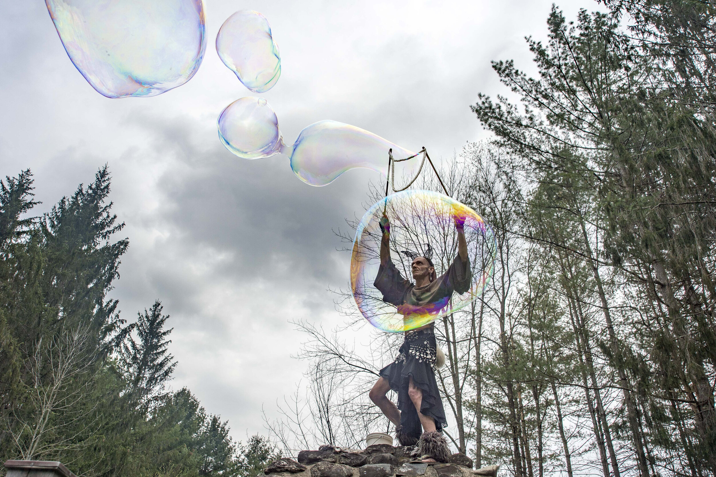  William Bridwell releases extra large bubbles into the crowd during the annual All Species Day Parade in Montpelier's Hubbard Park on Sunday, May 6th 2018.      