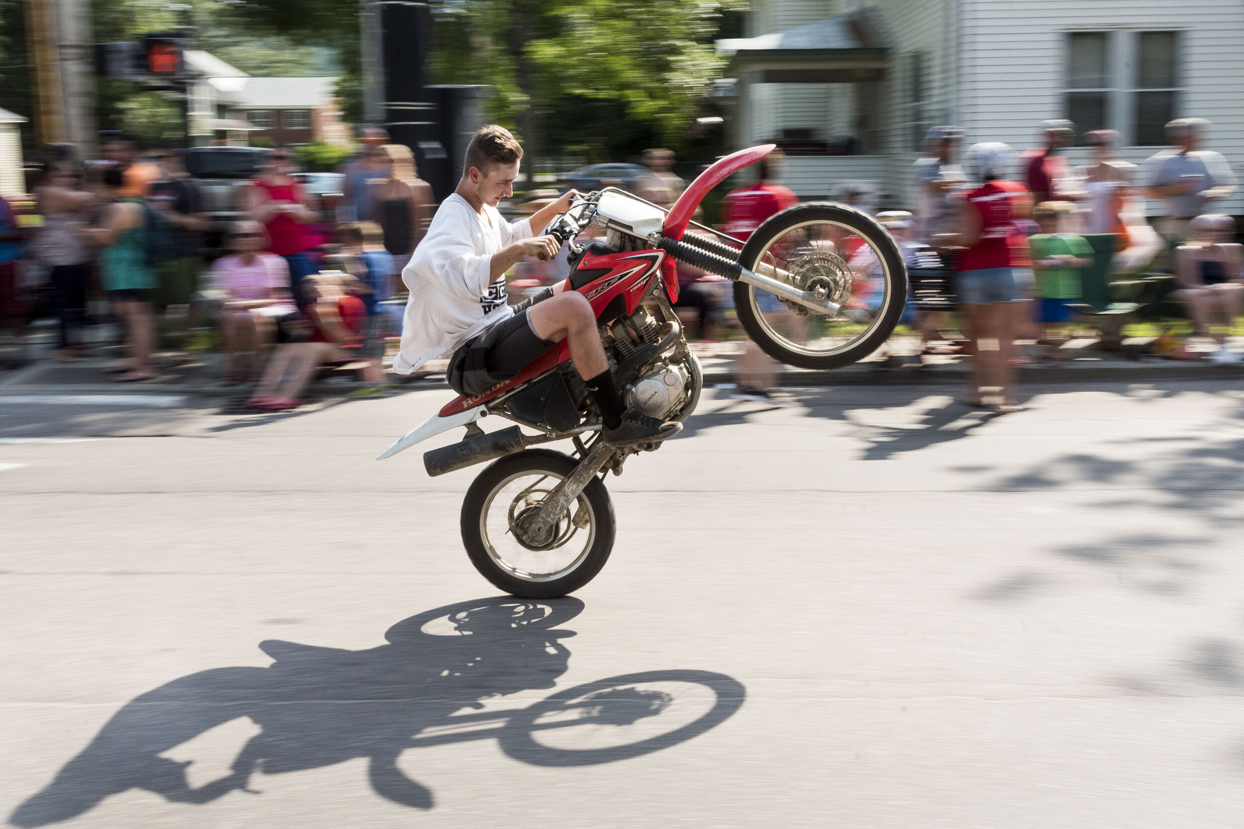  Noah Ladensack wows the crowd with a wheelie during the annual Not Quite Independence Day Parade in Waterbury, VT on Saturday, June 30th 2018.   