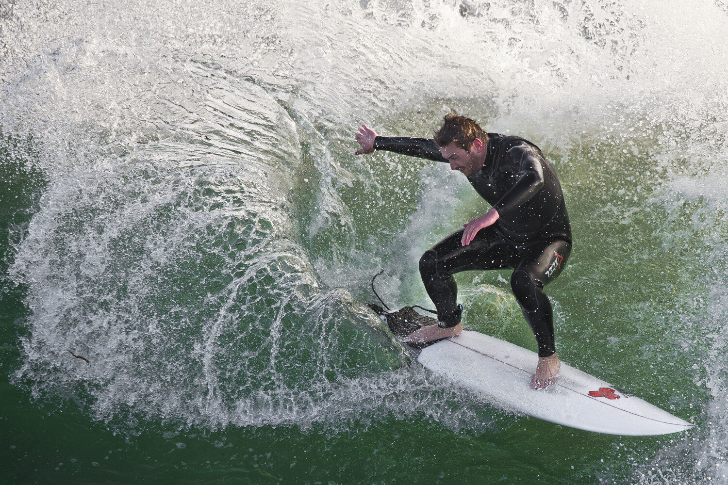  A surfer catches a wave at Steamer Lane in Santa Cruz, CA on Saturday, February 22nd 2014.  