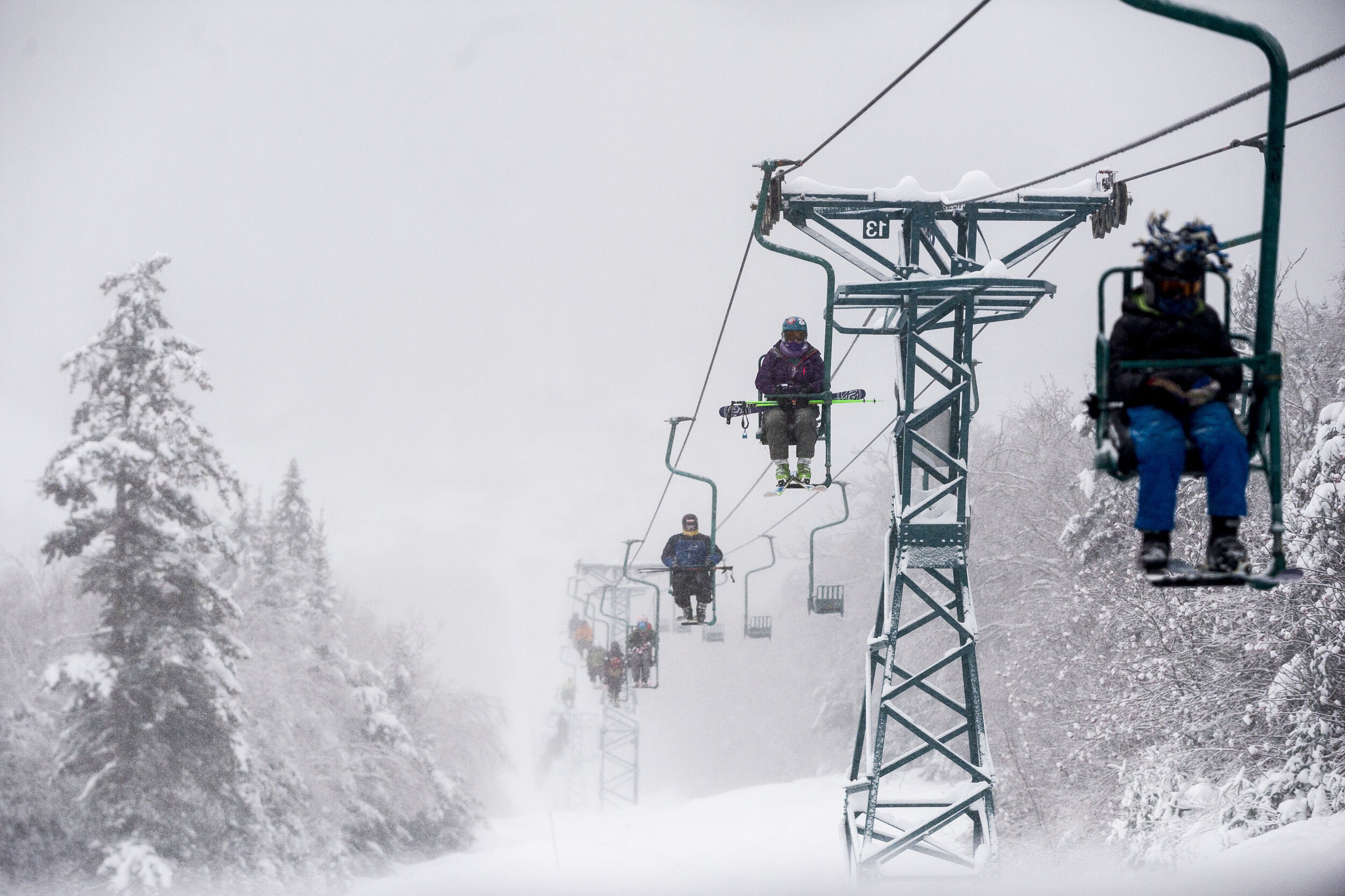  Skiers ride the single-chair lift to take advantage of fresh snowfall at Mad River Glen on Tuesday, December 26th 2017 in Waitsfield, VT. 