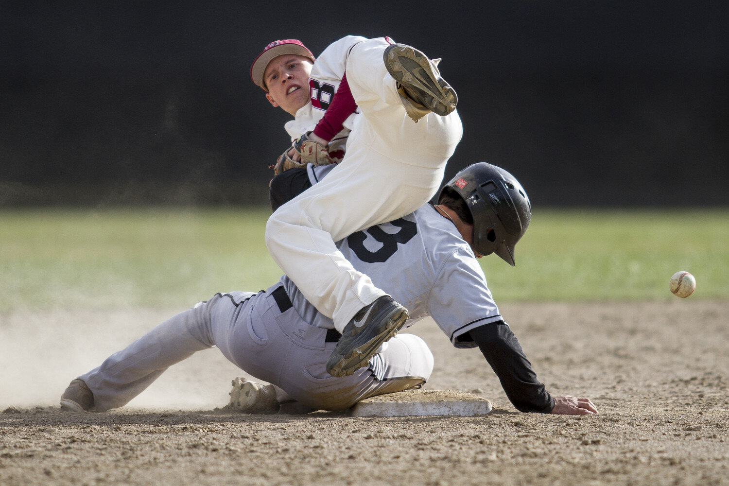  Bates College infielder Alex Parker loses the ball after a collision during the successful steal attempt of Bowdoin College’s Aaron Rosen on April 28th, 2015 in Lewiston, ME. 