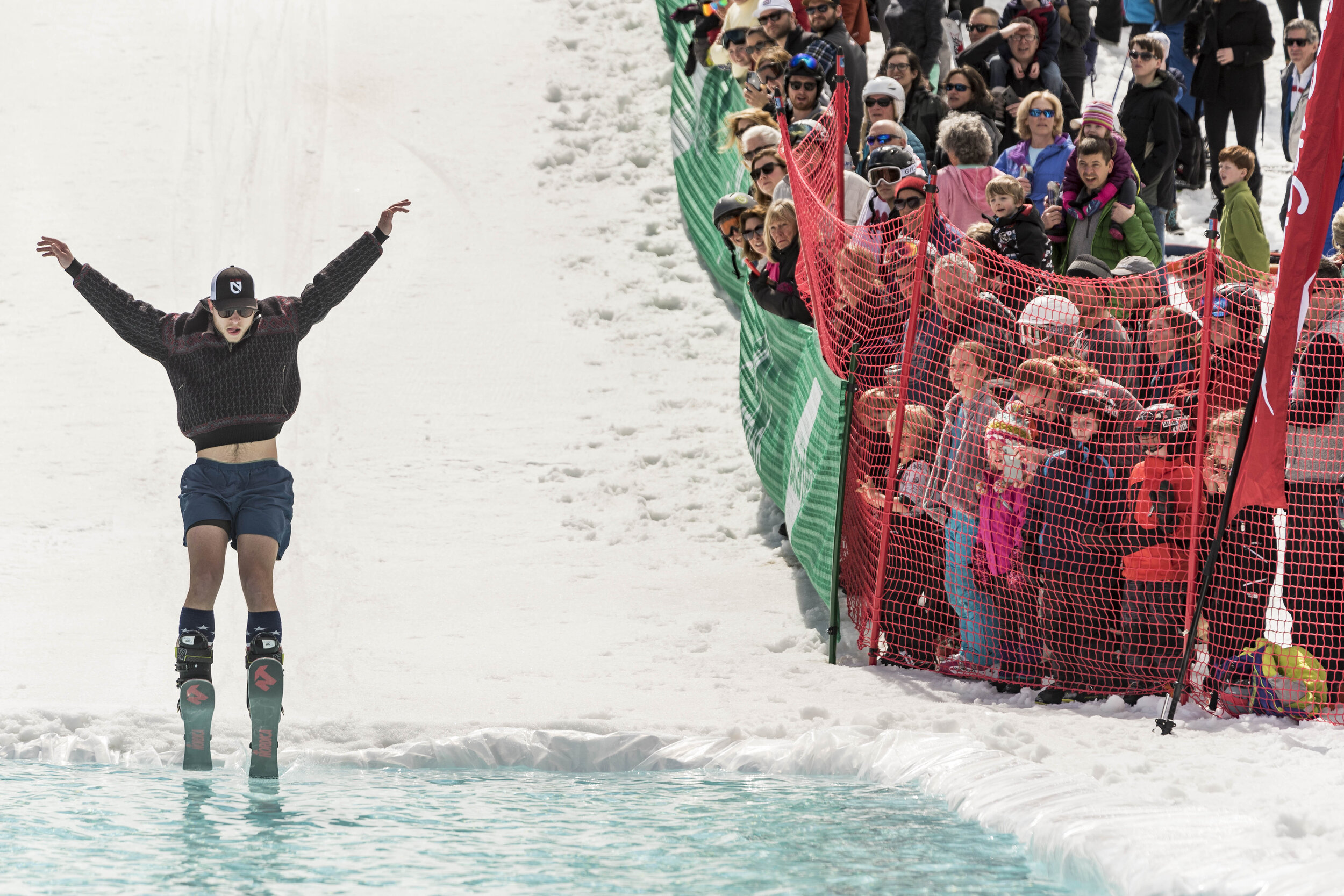  The crowd watches on during Sugarbush's Pond Skimming competition on Saturday, April 6th 2019 in Warren, VT.  