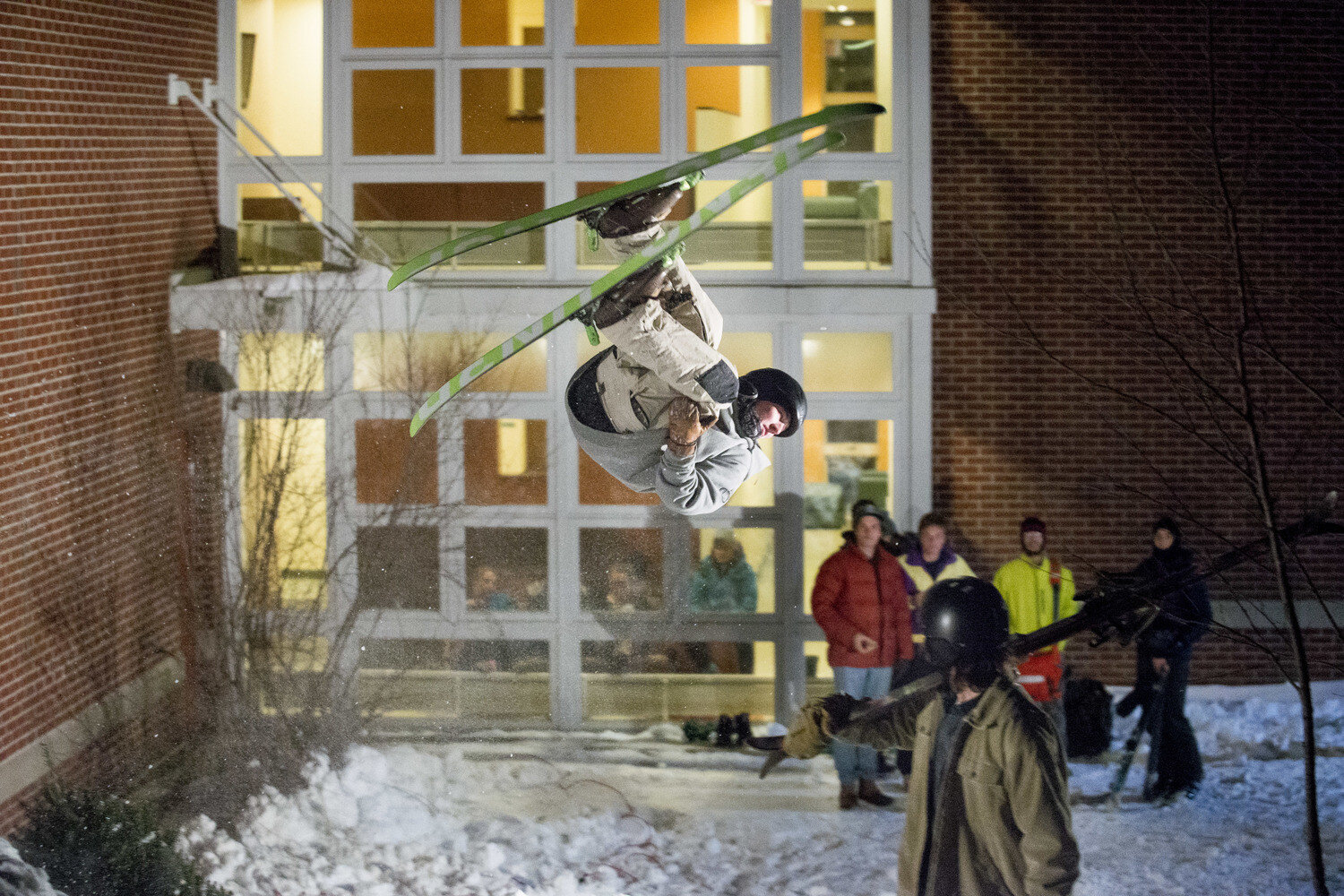  Patrick Sheils eyes the landing for his flip as the Bates Shred Club hosts "Skill 'N Grill," a featured event for Winter Carnival on Wednesday, Jan 20 2016 in Lewiston, ME. 