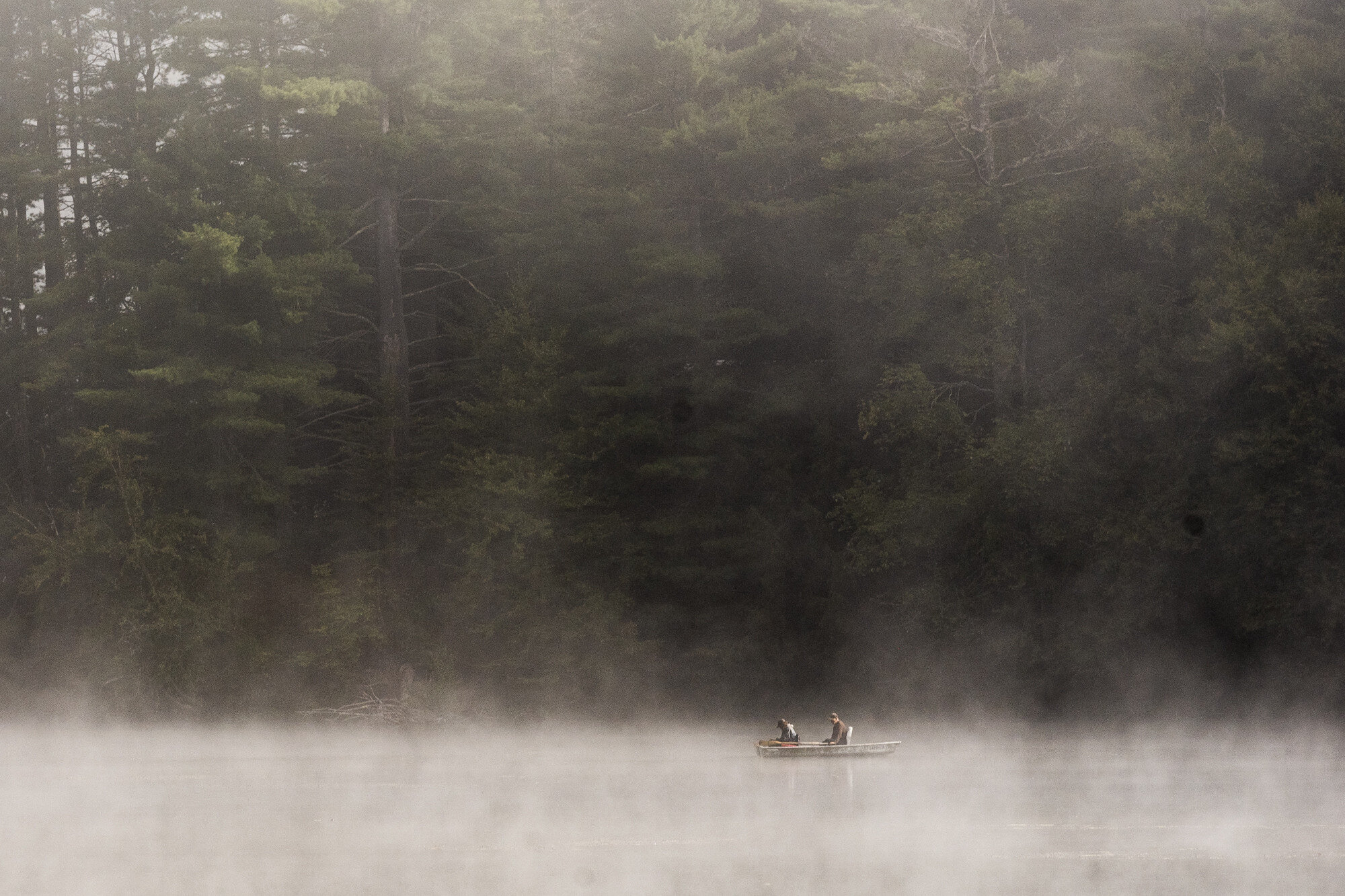  Fishermen share a kayak in the morning fog on North Montpelier Pond on Tuesday, August 27th 2019.  