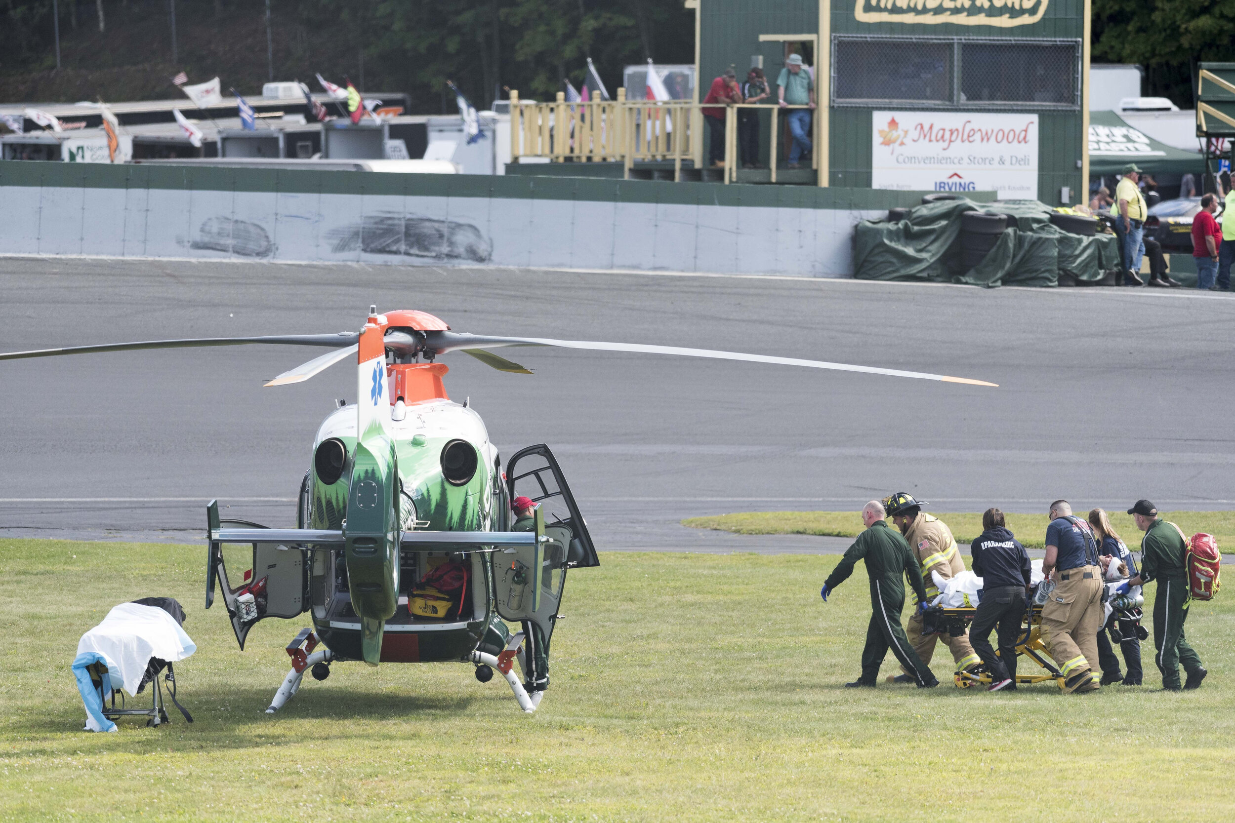  A track official is transported on the infield to the Dartmouth-Hitchcock Advanced Response Team Helicopter at Thunder Road International Speedway in Barre, VT on Sunday, September 1st 2019 following an on-track accident in a preliminary heat of the