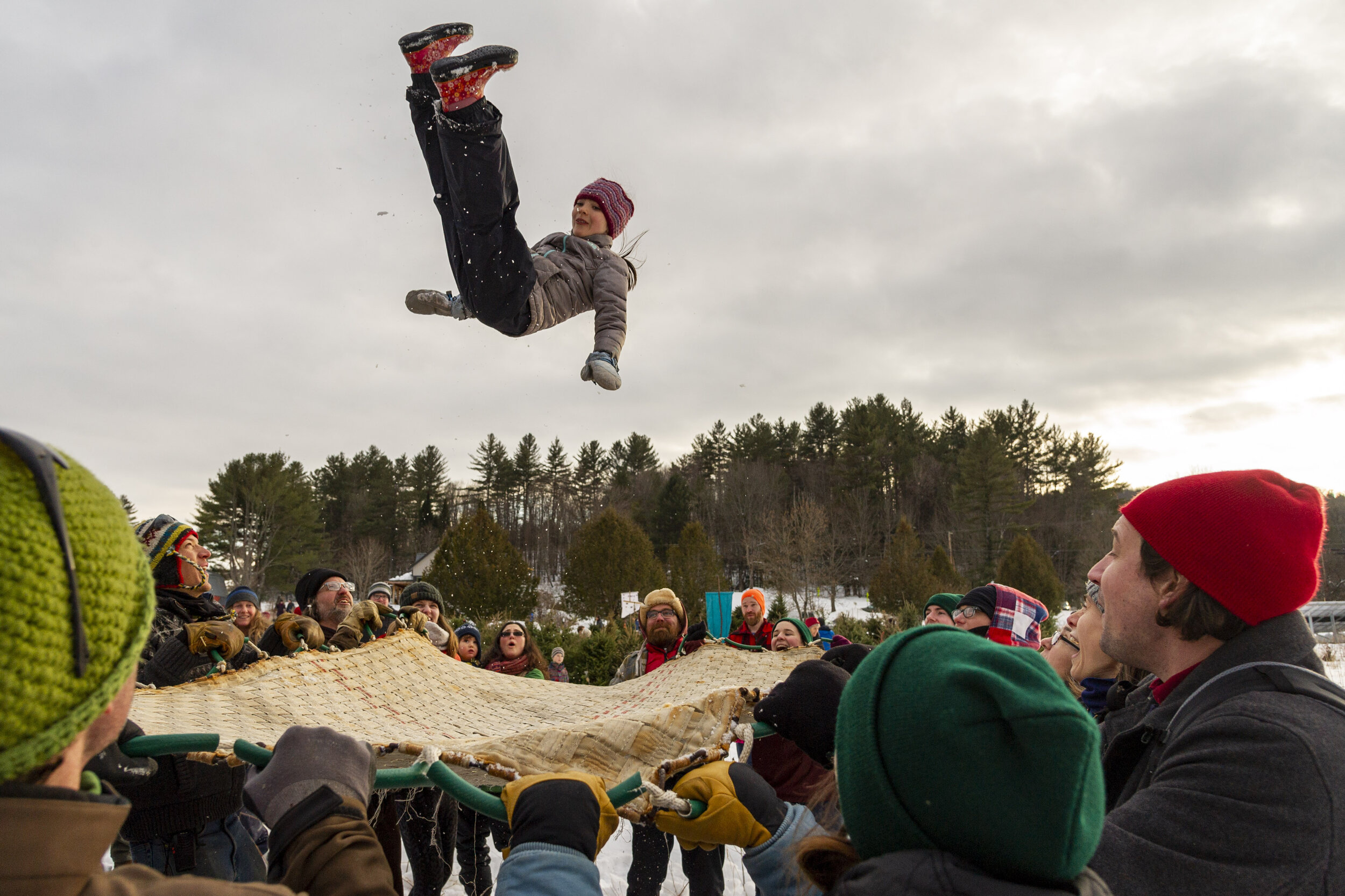  Maia Boyer braces for impact at the blanket toss during the Ice On Fire festival at the North Branch Nature Center in Montpelier, VT on Sunday, February 2nd 2020. 