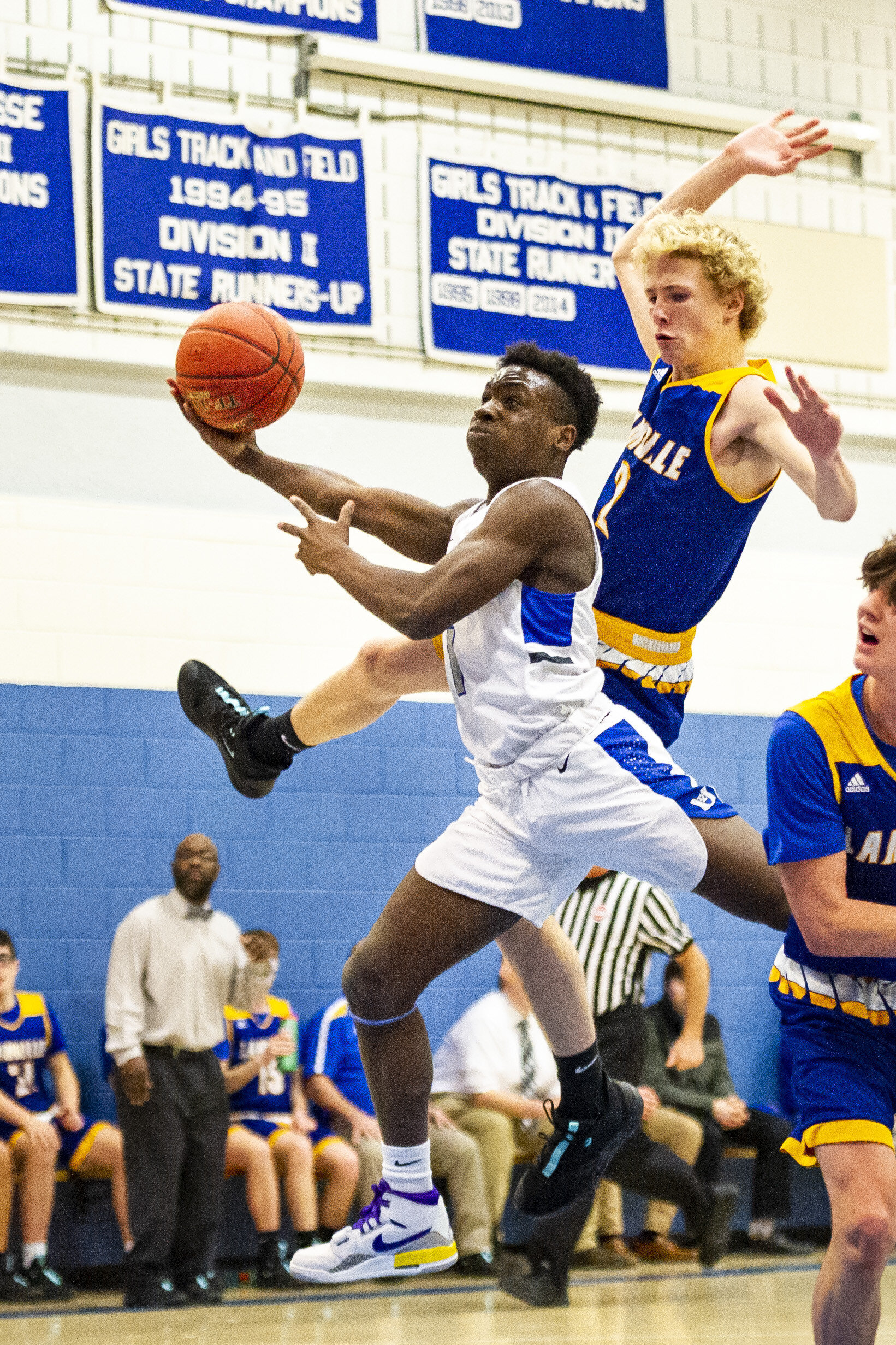  U-32’s Aiden Hawkins rises to the hoop past the high-flying defense of Lamoille Valley Union’s Ethan Alexander on Monday, January 13th 2020 in Montpelier, VT. 