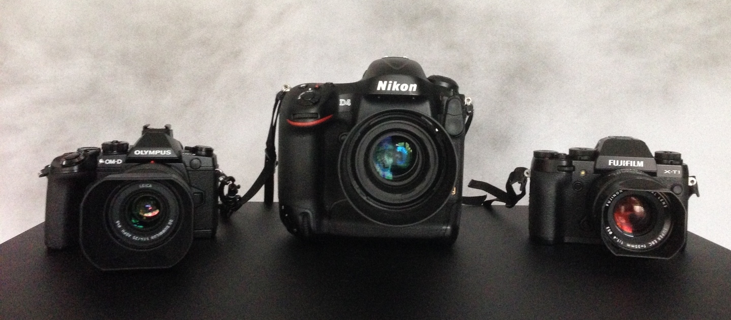 The Olympus OM-D EM1, The Nikon D4, and the Fuji XT-1 with their 50MM Equivalent lenses. 