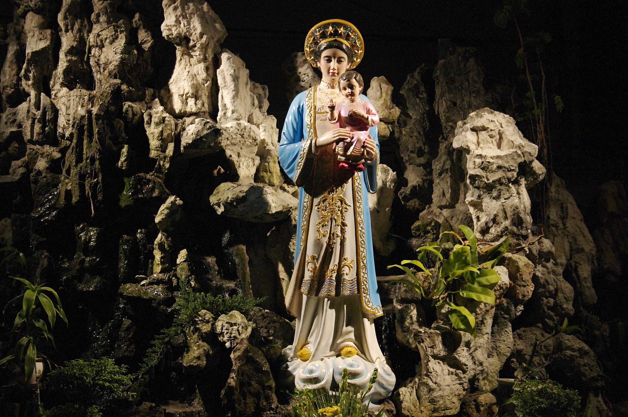 A late night walk-about through some sketchy neighborhoods and no indication of how to get home brought us to a beautiful church with this grotto of the Blessed Mother.