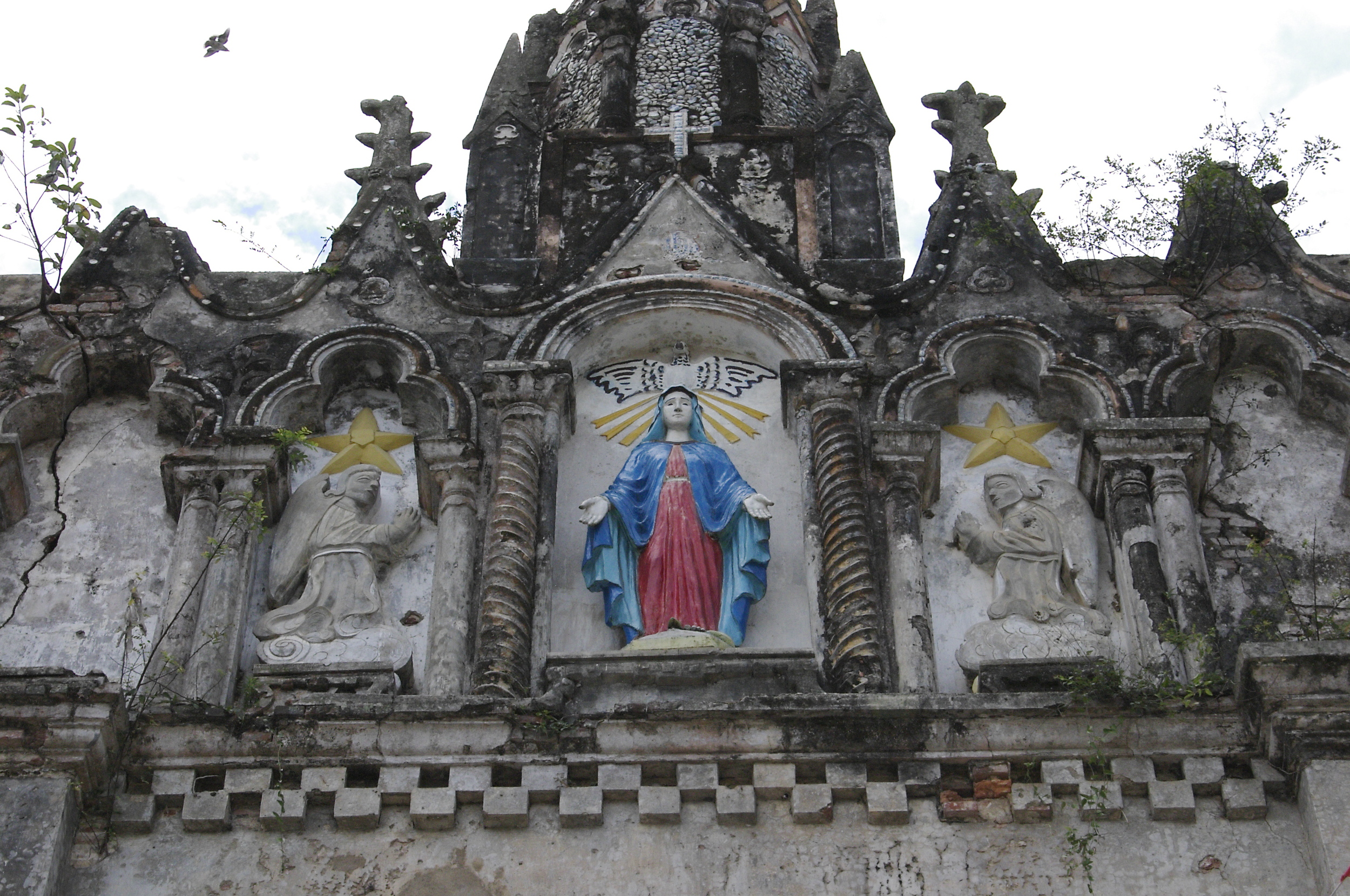  This church remains scarred from the Vietnam War (known as the American War in Vietnam). The pastor is Fr. Francis' brother. 