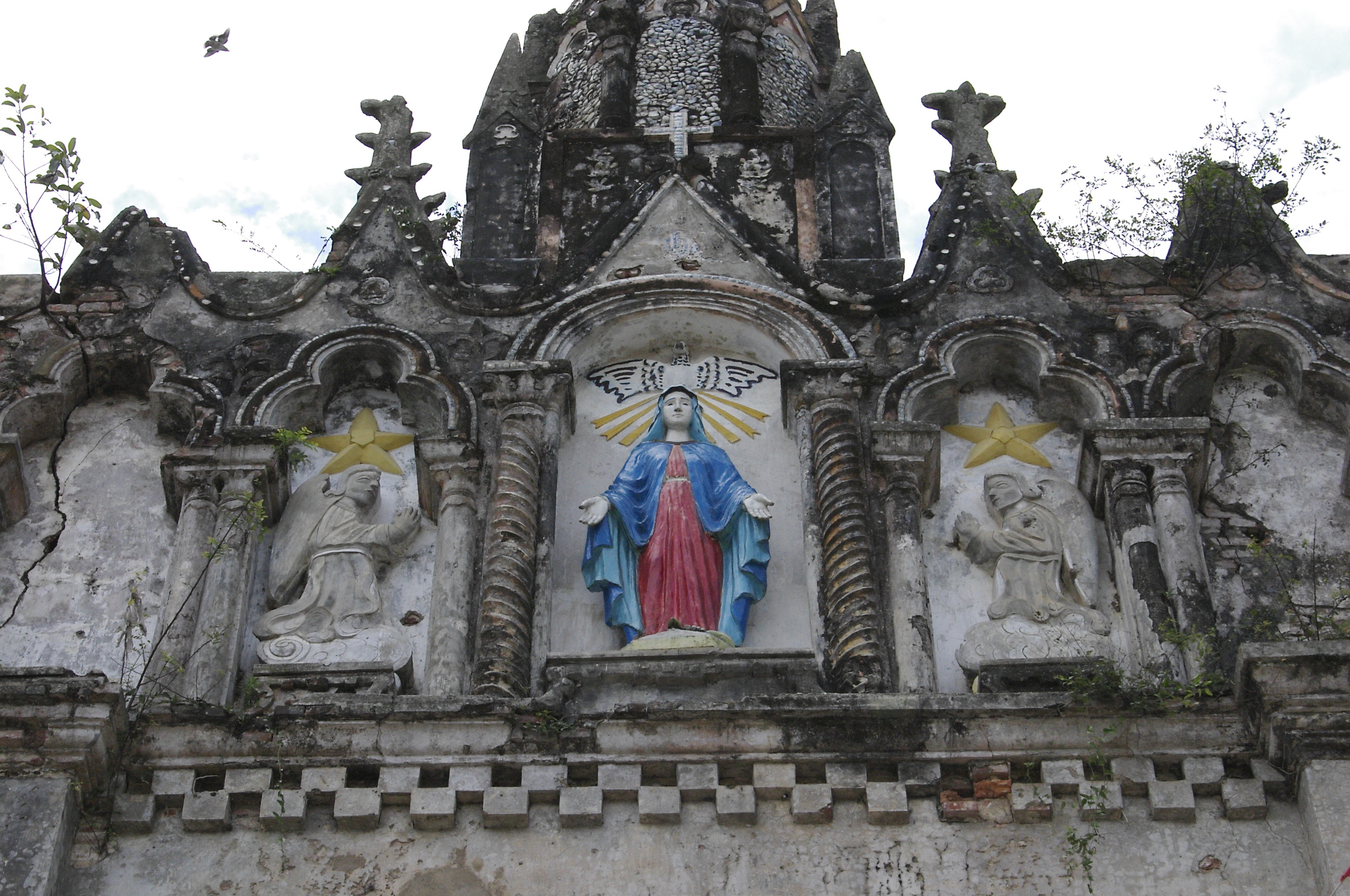 This church remains scarred from the Vietnam War (known as the American War in Vietnam). The pastor is Fr. Francis' brother.