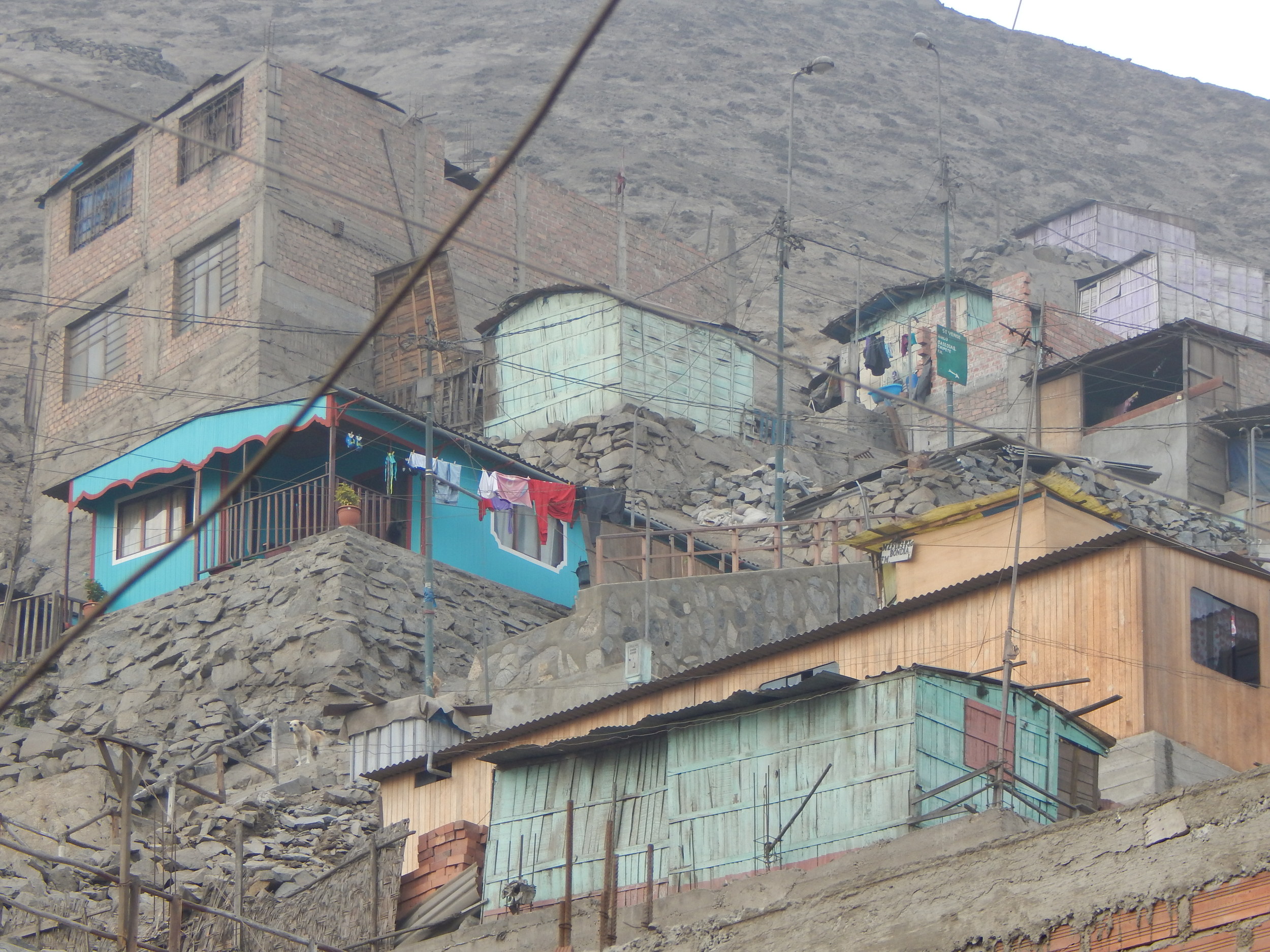 A typical neighborhood, houses clinging to dirt hillsides