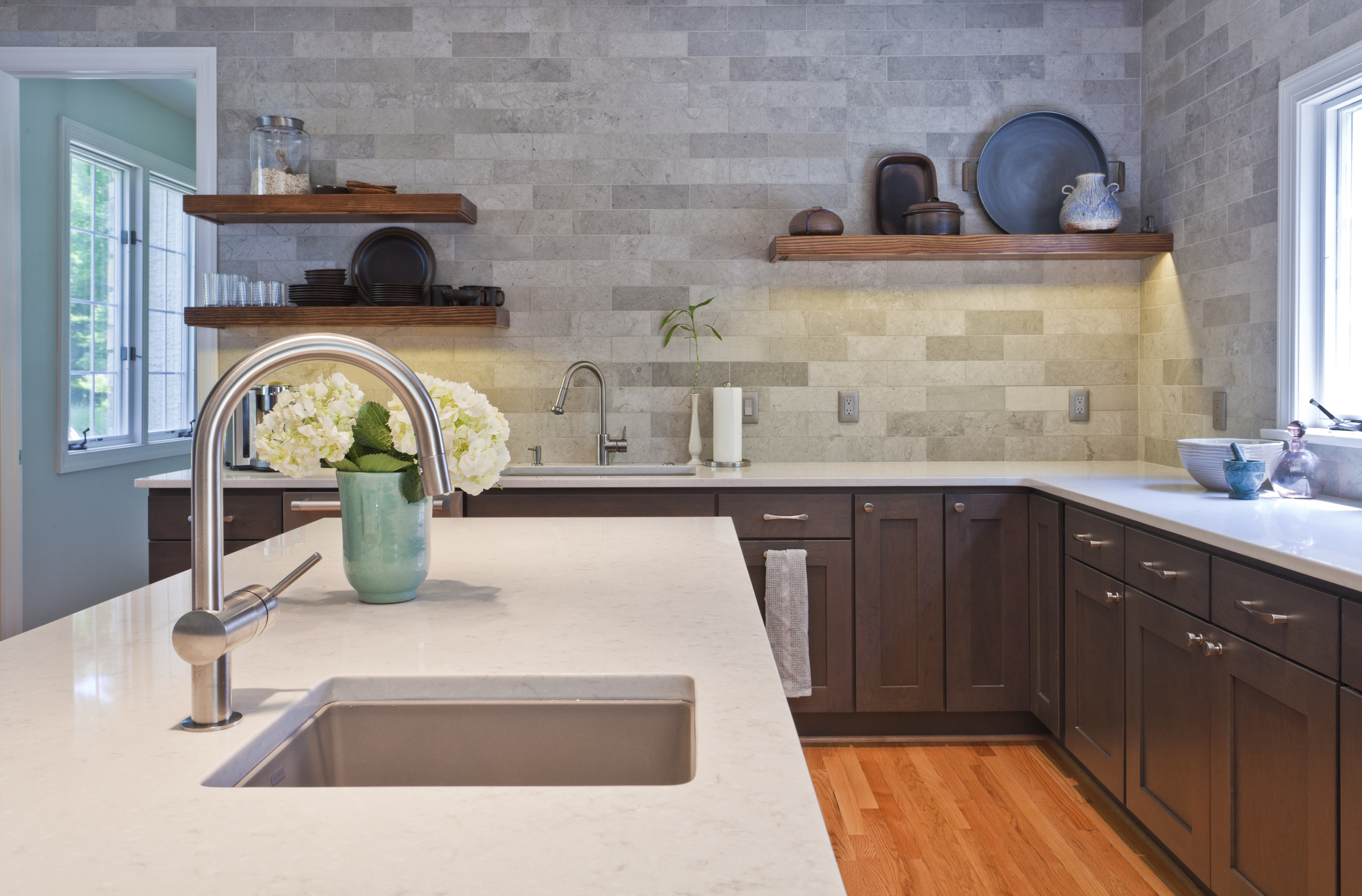 Note the beautiful floating shelves the undercount lighting. Quite dramatic!
