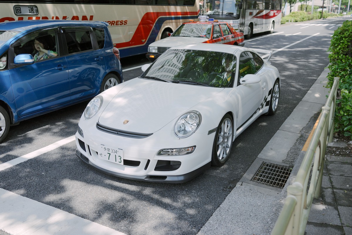 Love the yellow seat belts. A Porsche GT3 in Shinjuku.