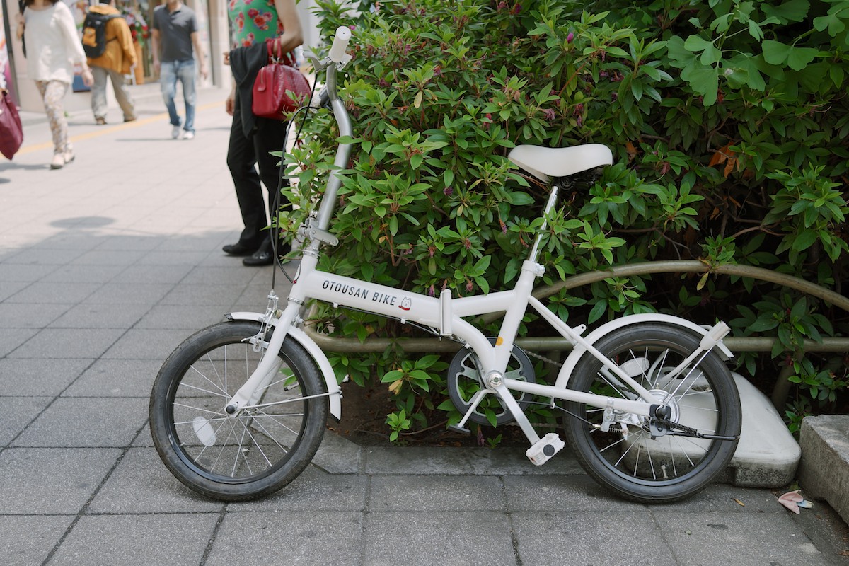 A folding bike. Otousan is the mascot for the Japanese cellular company, Softbank.