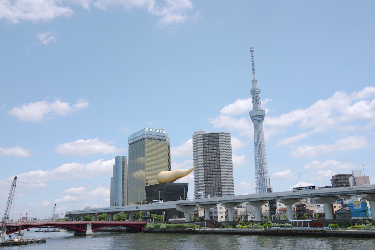 That strange looking gold/black building is the famous Asahi Beer Hall designed by Philippe Starck.
