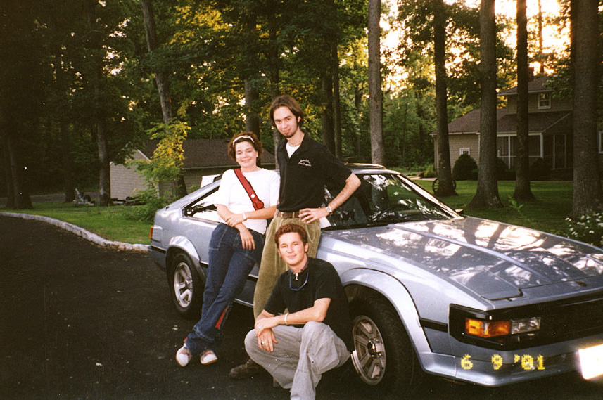 Michael and friends posing with his 1984 Toyota Supra