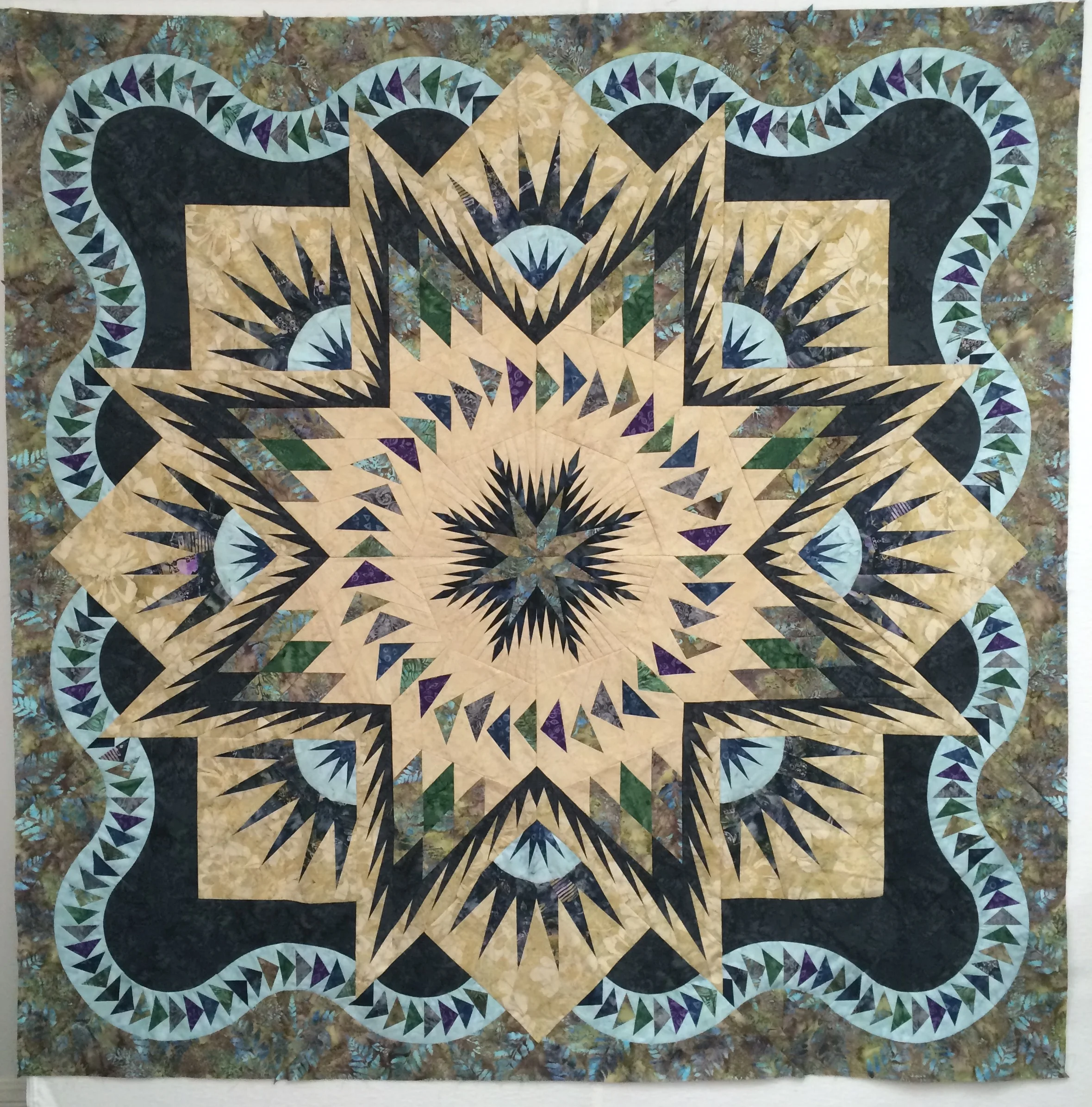 The finished quilt top. We have kits available in these fabrics.