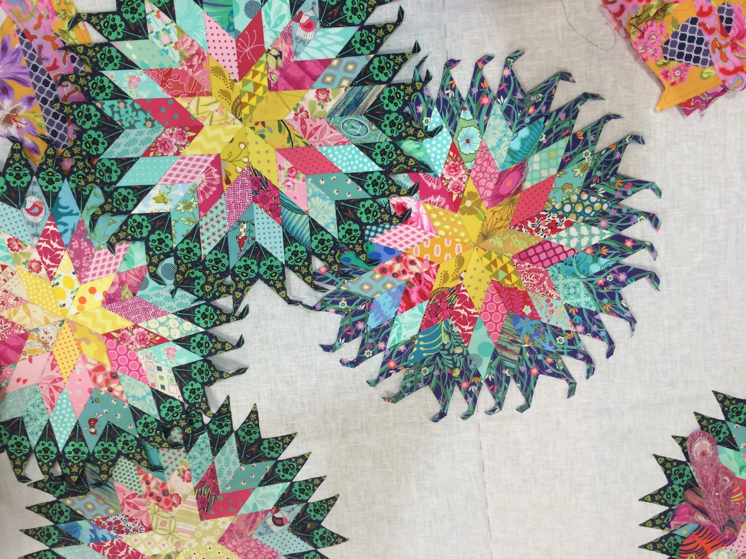 Julie's paper pieced stars need to be positioned.