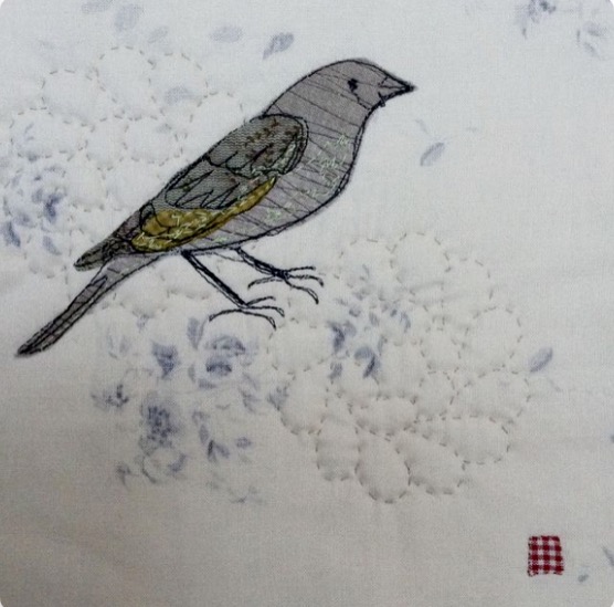 A little green finch.