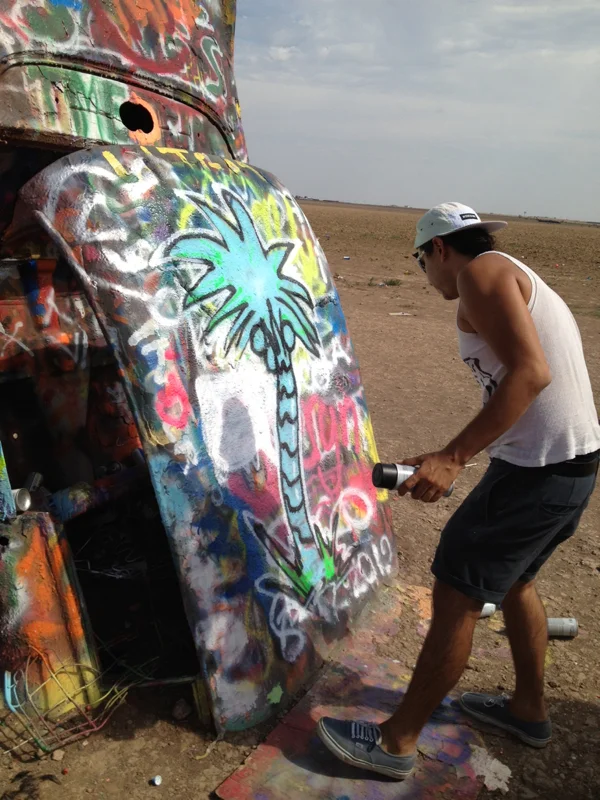 Yatika at Cadillac ranch Amarillo, TX making a mark