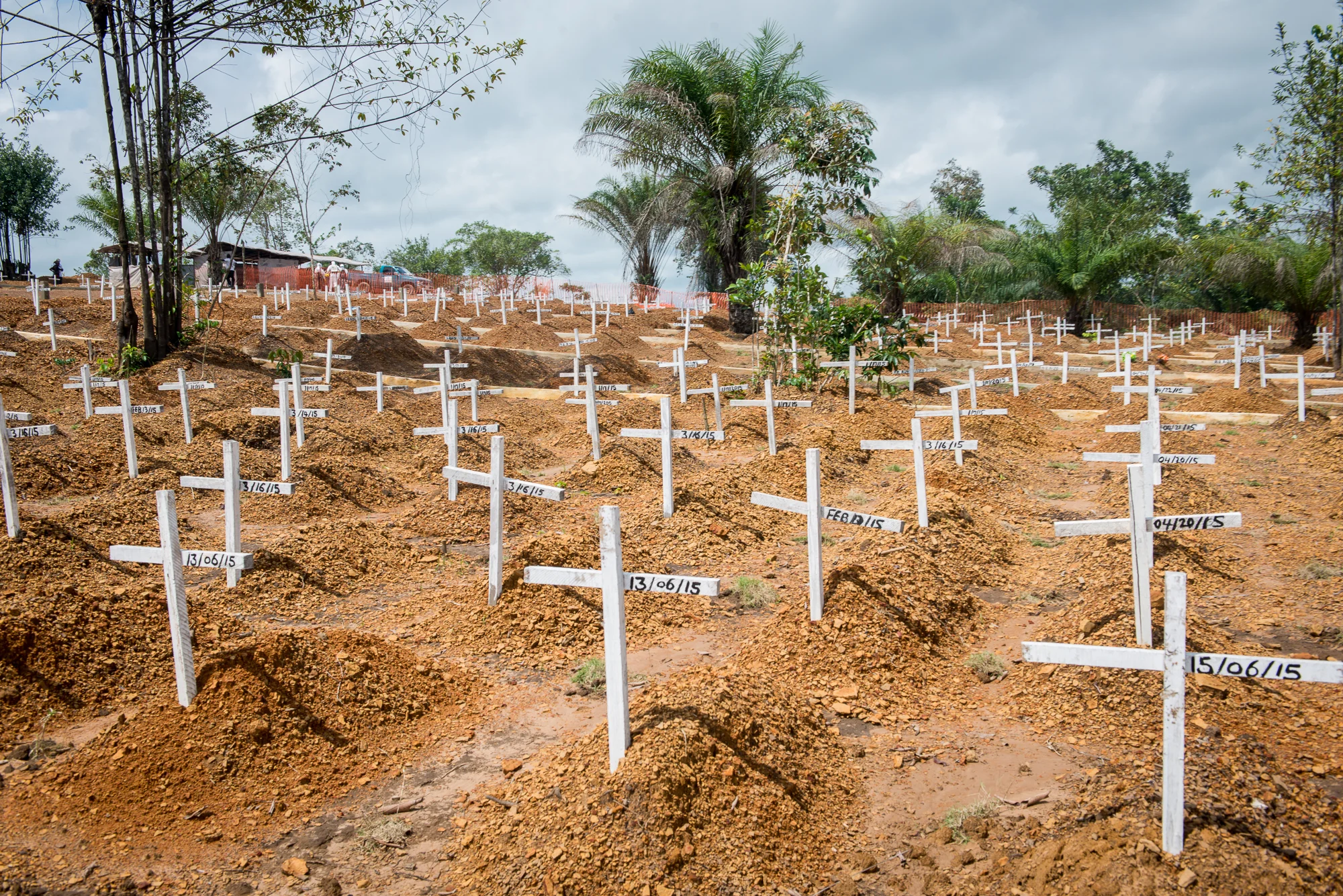 By early July 2015, more than 1,400 people had been buried at Disco Hill Cemetery outside Liberia's capitol city, Monrovia. Established on Christmas Eve, 2014, the cemetery provides a place for "safe" burials to be performed daily. Everyone interred there is buried as if they had been infected with the Ebola virus, regardless of the cause of death. Bodies are sealed in plastic bags and handled only by burial teams dressed in full protective gear. The precautions are designed to prevent another outbreak.