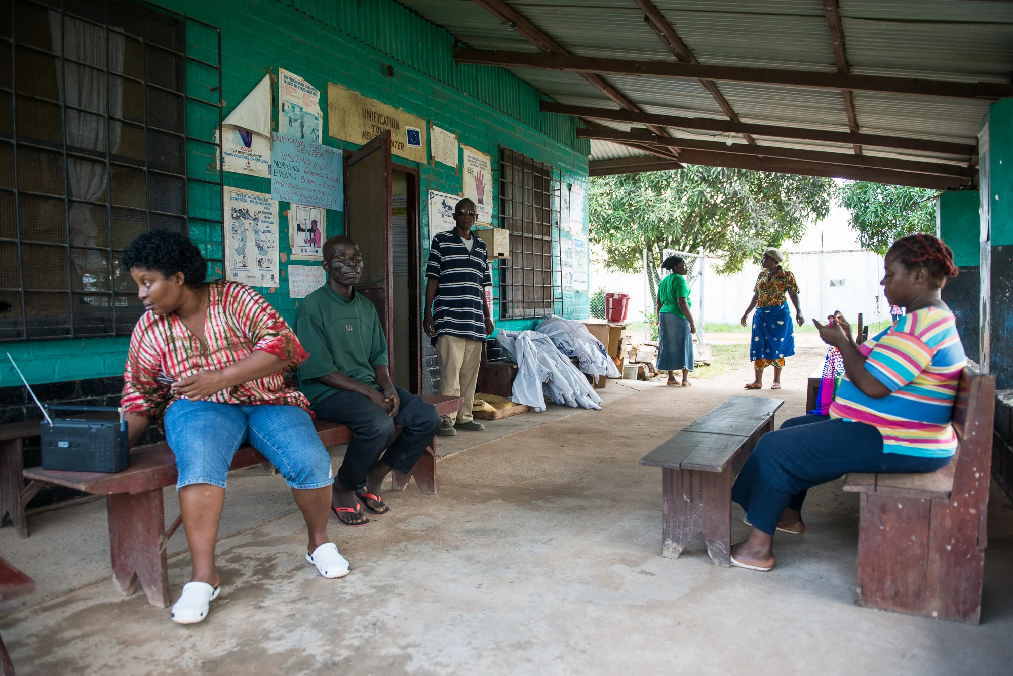 Quarantined health workers pass the time on Wednesday, July 1 at the Unification Town Clinic in Margibi County, Liberia. Twelve of the clinic's employees will remain there for 21 days for observation because they had contact with Abraham Memaigar, a young man whose corpse tested positive for Ebola.