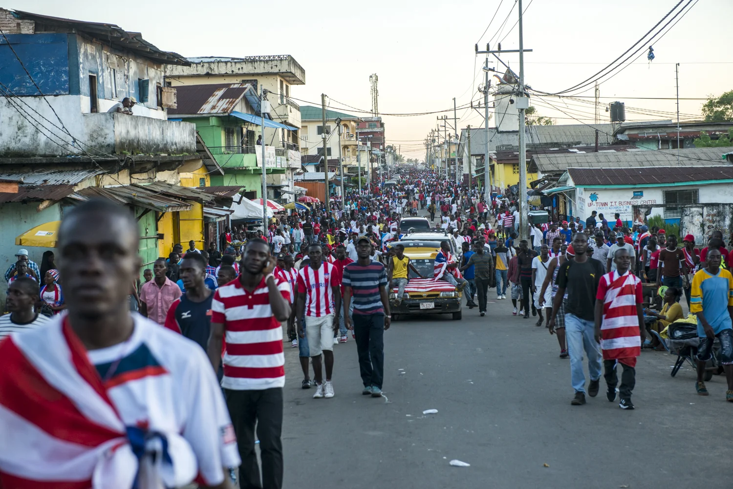 This story was originally published by The Player's Tribune on Oct. 29, 2015. When the Ebola outbreak occurred in Liberia in 2014, one of the biggest cultural impacts was the government’s decision last June to ban all soccer play in an effort to reduce to spread of the virus through physical contact. With the number of cases declining, the ban on soccer was lifted in January. Nearly 5,000 people died before the country was declared Ebola-free this past May. This summer, a three-day tournament took place in Logan Town, a community north of Monrovia, that consisted of both men’s soccer matches and women’s kick ball games. The tournament was played on a large, muddy patch of oddly-shaped common area, which included the only road into that part of Logan Town. As such, the goals (made out of netting and tree branches) were not placed directly opposite each other, and a large delivery truck drove across the field repeatedly interrupting play. A party-like atmosphere surrounded the event, with loud music playing and many people drinking cheap booze out of small plastic bottles. Younger kids watched the matches eagerly, jockeying for every opportunity to run after an out-of-bounds ball and throw it back into play. When the last soccer match came down to a penalty shootout, a thick mob of people formed around the goal. Team bragging rights and a small cash prize were on the line. The kick was good and celebrations could finally begin. On Oct. 8, 2015 Liberia’s national team, the Lone Stars, played Guinea-Bissau in a FIFA World Cup Qualifying match, which was held on a regulation field at Antoinette Tubman Stadium in central Monrovia. Following the Ebola outbreak and the ban of soccer in the country in 2014, the stadium was converted for use as an Ebola Treatment Unit. Now back to it’s originally intended use, rowdy, celebrating Liberians packed the stadium for the match, which ended in a 1-1 tie. A week later, Liberia pulled off an unexpected win against Guinea-Bissau. Liberia is now scheduled to play Ivory Coast in a second-round qualifying match on Nov. 11. “If Liberia loses, there will be a riot,” one fan said. “If we win, there will still probably be a riot.”