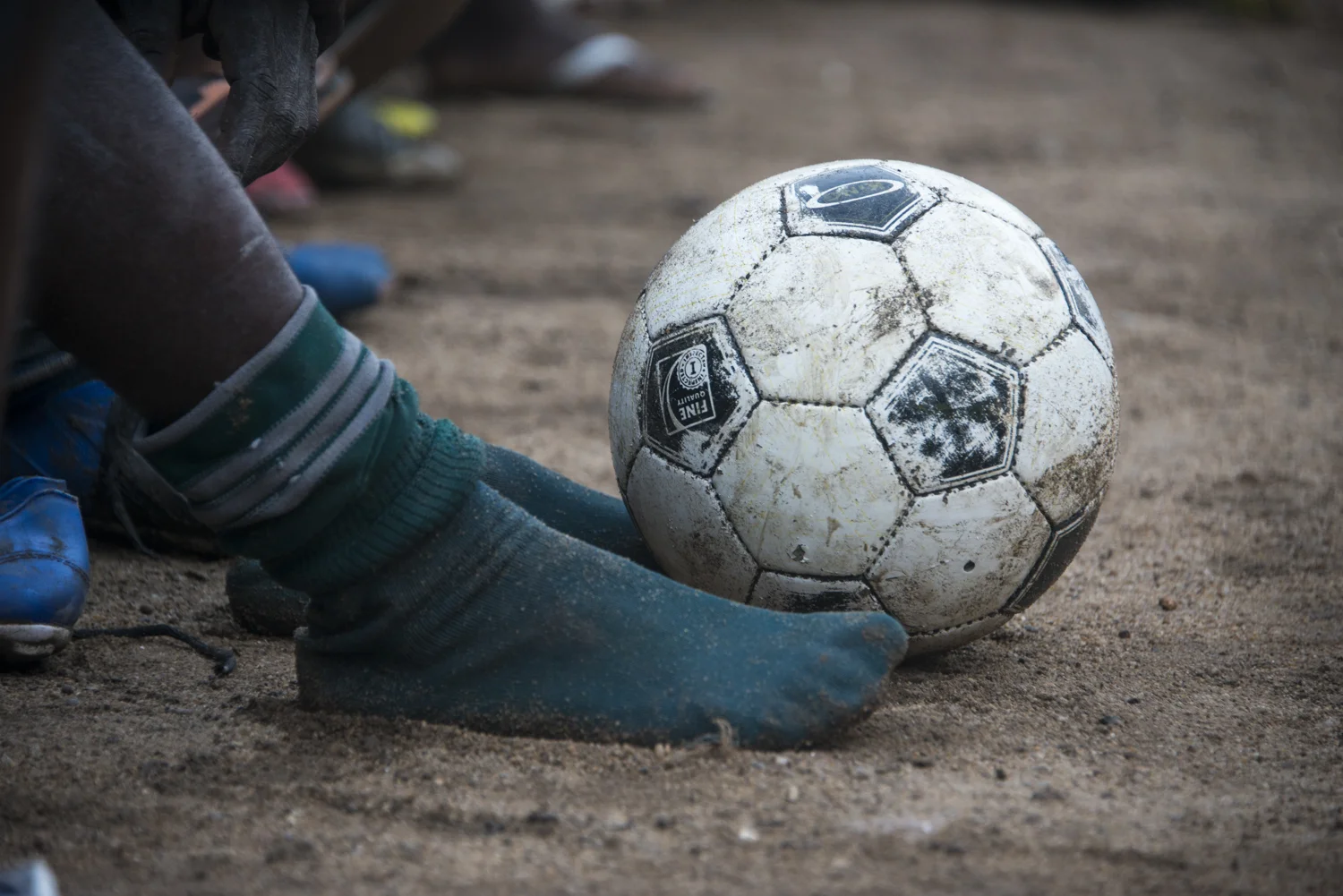This story was originally published by The Player's Tribune on Oct. 29, 2015. When the Ebola outbreak occurred in Liberia in 2014, one of the biggest cultural impacts was the government’s decision last June to ban all soccer play in an effort to reduce to spread of the virus through physical contact. With the number of cases declining, the ban on soccer was lifted in January. Nearly 5,000 people died before the country was declared Ebola-free this past May. This summer, a three-day tournament took place in Logan Town, a community north of Monrovia, that consisted of both men’s soccer matches and women’s kick ball games. The tournament was played on a large, muddy patch of oddly-shaped common area, which included the only road into that part of Logan Town. As such, the goals (made out of netting and tree branches) were not placed directly opposite each other, and a large delivery truck drove across the field repeatedly interrupting play. A party-like atmosphere surrounded the event, with loud music playing and many people drinking cheap booze out of small plastic bottles. Younger kids watched the matches eagerly, jockeying for every opportunity to run after an out-of-bounds ball and throw it back into play. When the last soccer match came down to a penalty shootout, a thick mob of people formed around the goal. Team bragging rights and a small cash prize were on the line. The kick was good and celebrations could finally begin. On Oct. 8, 2015 Liberia’s national team, the Lone Stars, played Guinea-Bissau in a FIFA World Cup Qualifying match, which was held on a regulation field at Antoinette Tubman Stadium in central Monrovia. Following the Ebola outbreak and the ban of soccer in the country in 2014, the stadium was converted for use as an Ebola Treatment Unit. Now back to it’s originally intended use, rowdy, celebrating Liberians packed the stadium for the match, which ended in a 1-1 tie. A week later, Liberia pulled off an unexpected win against Guinea-Bissau. Liberia is now scheduled to play Ivory Coast in a second-round qualifying match on Nov. 11. “If Liberia loses, there will be a riot,” one fan said. “If we win, there will still probably be a riot.”