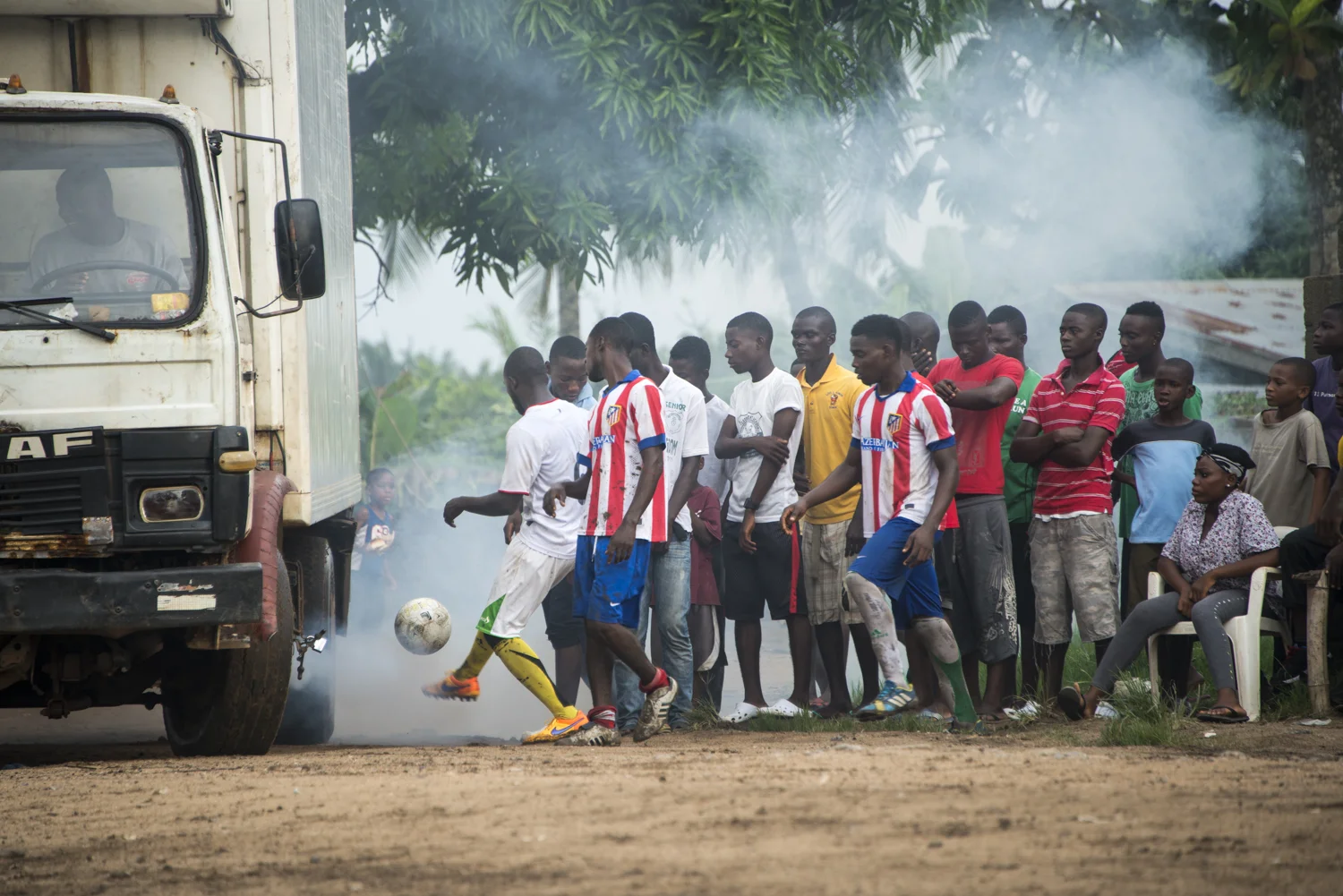 This story was originally published by The Player's Tribune on Oct. 29, 2015. When the Ebola outbreak occurred in Liberia in 2014, one of the biggest cultural impacts was the government’s decision last June to ban all soccer play in an effort to reduce to spread of the virus through physical contact. With the number of cases declining, the ban on soccer was lifted in January. Nearly 5,000 people died before the country was declared Ebola-free this past May. This summer, a three-day tournament took place in Logan Town, a community north of Monrovia, that consisted of both men’s soccer matches and women’s kick ball games. The tournament was played on a large, muddy patch of oddly-shaped common area, which included the only road into that part of Logan Town. As such, the goals (made out of netting and tree branches) were not placed directly opposite each other, and a large delivery truck drove across the field repeatedly interrupting play. A party-like atmosphere surrounded the event, with loud music playing and many people drinking cheap booze out of small plastic bottles. Younger kids watched the matches eagerly, jockeying for every opportunity to run after an out-of-bounds ball and throw it back into play. When the last soccer match came down to a penalty shootout, a thick mob of people formed around the goal. Team bragging rights and a small cash prize were on the line. The kick was good and celebrations could finally begin. On Oct. 8, 2015 Liberia’s national team, the Lone Stars, played Guinea-Bissau in a FIFA World Cup Qualifying match, which was held on a regulation field at Antoinette Tubman Stadium in central Monrovia. Following the Ebola outbreak and the ban of soccer in the country in 2014, the stadium was converted for use as an Ebola Treatment Unit. Now back to it’s originally intended use, rowdy, celebrating Liberians packed the stadium for the match, which ended in a 1-1 tie. A week later, Liberia pulled off an unexpected win against Guinea-Bissau. Liberia is now scheduled to play Ivory Coast in a second-round qualifying match on Nov. 11. “If Liberia loses, there will be a riot,” one fan said. “If we win, there will still probably be a riot.”