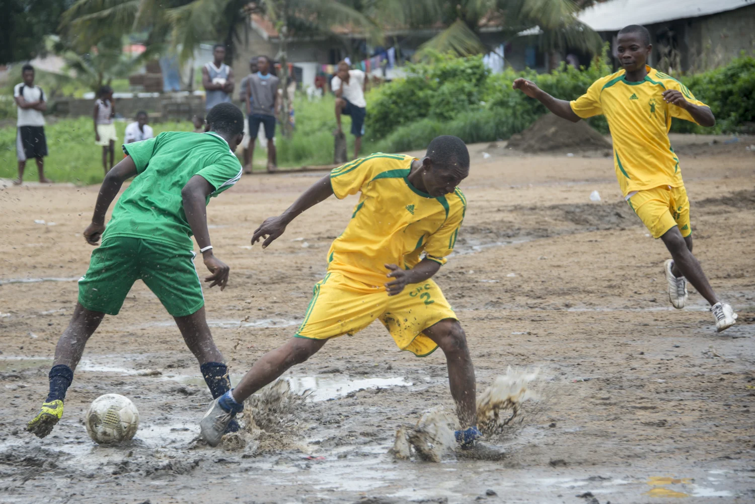 This story was originally published by The Player's Tribune on Oct. 29, 2015. When the Ebola outbreak occurred in Liberia in 2014, one of the biggest cultural impacts was the government’s decision last June to ban all soccer play in an effort to reduce to spread of the virus through physical contact. With the number of cases declining, the ban on soccer was lifted in January. Nearly 5,000 people died before the country was declared Ebola-free this past May. This summer, a three-day tournament took place in Logan Town, a community north of Monrovia, that consisted of both men’s soccer matches and women’s kick ball games. The tournament was played on a large, muddy patch of oddly-shaped common area, which included the only road into that part of Logan Town. As such, the goals (made out of netting and tree branches) were not placed directly opposite each other, and a large delivery truck drove across the field repeatedly interrupting play. A party-like atmosphere surrounded the event, with loud music playing and many people drinking cheap booze out of small plastic bottles. Younger kids watched the matches eagerly, jockeying for every opportunity to run after an out-of-bounds ball and throw it back into play. When the last soccer match came down to a penalty shootout, a thick mob of people formed around the goal. Team bragging rights and a small cash prize were on the line. The kick was good and celebrations could finally begin. On Oct. 8, 2015 Liberia’s national team, the Lone Stars, played Guinea-Bissau in a FIFA World Cup Qualifying match, which was held on a regulation field at Antoinette Tubman Stadium in central Monrovia. Following the Ebola outbreak and the ban of soccer in the country in 2014, the stadium was converted for use as an Ebola Treatment Unit. Now back to it’s originally intended use, rowdy, celebrating Liberians packed the stadium for the match, which ended in a 1-1 tie. A week later, Liberia pulled off an unexpected win against Guinea-Bissau. Liberia is now scheduled to play Ivory Coast in a second-round qualifying match on Nov. 11. “If Liberia loses, there will be a riot,” one fan said. “If we win, there will still probably be a riot.”