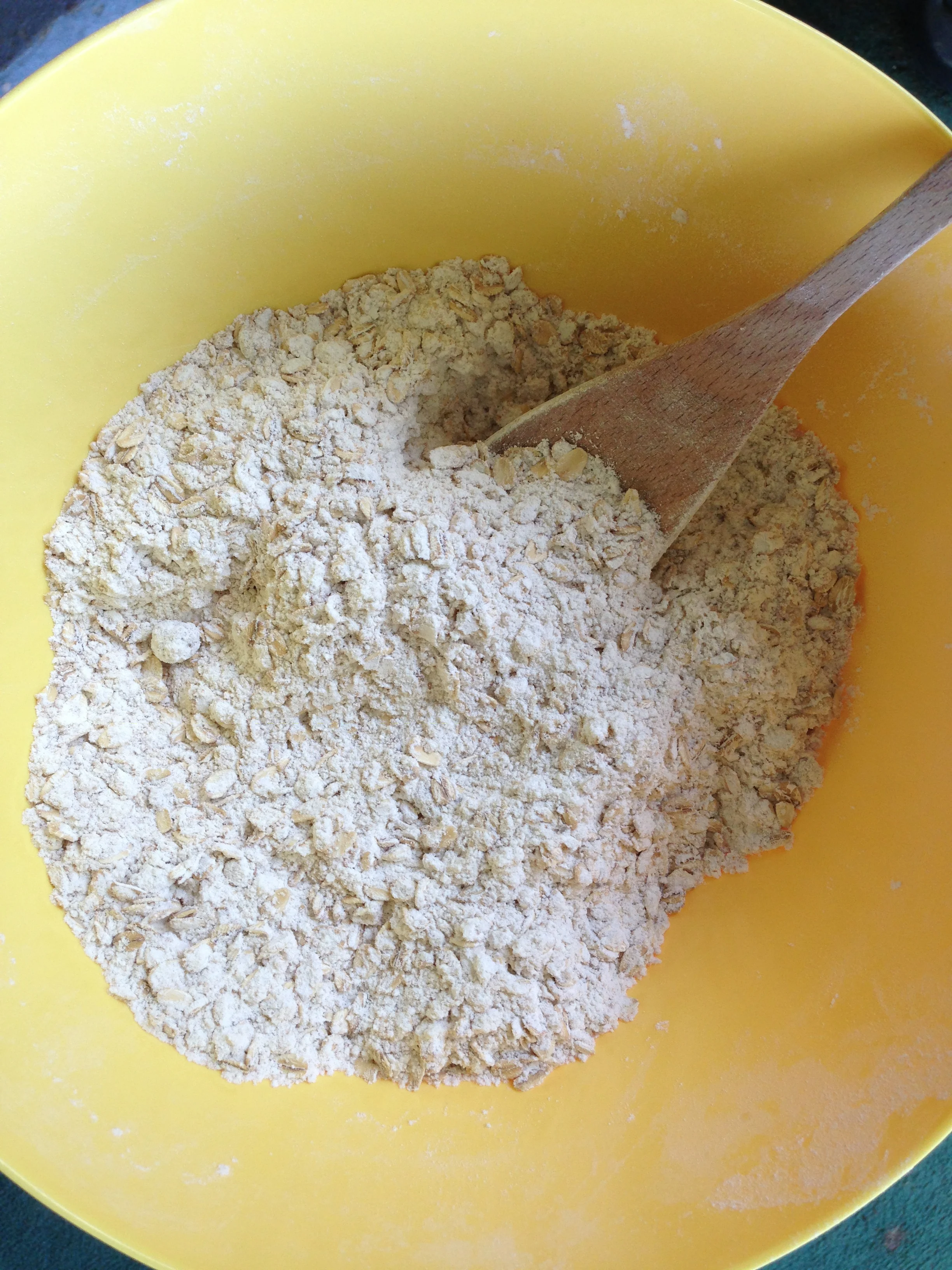 Preheat the Oven to 350 degrees. Mix the oats, flour, brown sugar, baking soda, and salt together in a bowl. As you measure each ingredient, let your toddler dump it into the bowl and stir. My daughter dearly loves this part and shouts "Dump it! My dump it!" Be ready for flour to get on the floor, of course. I remind her to keep it in the bowl, but hey, the mess is part of the fun.