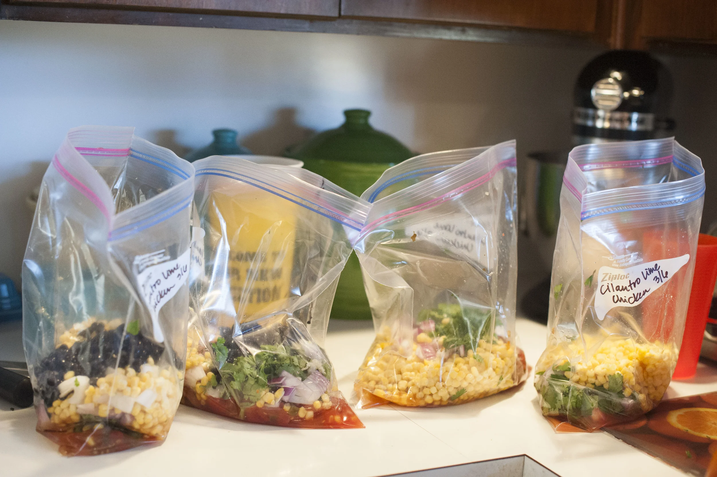 It's always best to put your sauce or smaller ingredients in the bag first, so you can mix it well, before you add the meat. I will put the bags in large plastic cups so they will sit straight up if they won't sit up on their own.