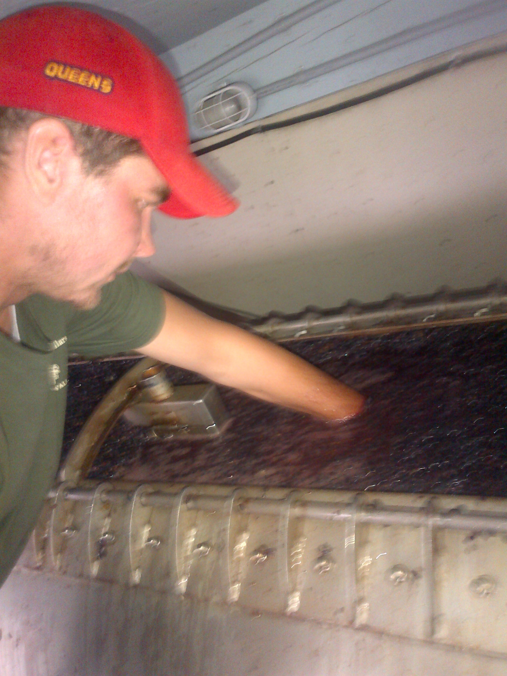  Me stuffing the corners of the press with Pinot...​ 