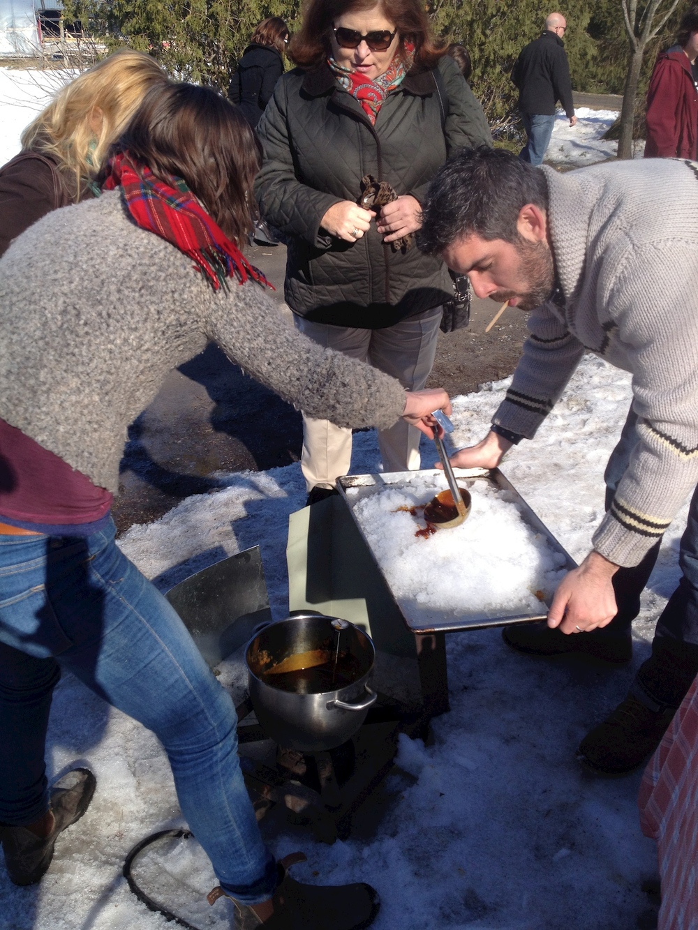   La Ferme ÄLska  owner  Genevieve   @alskafarm  and Andrew Gilbotawicz testing out her fresh maple taffy. ​ 