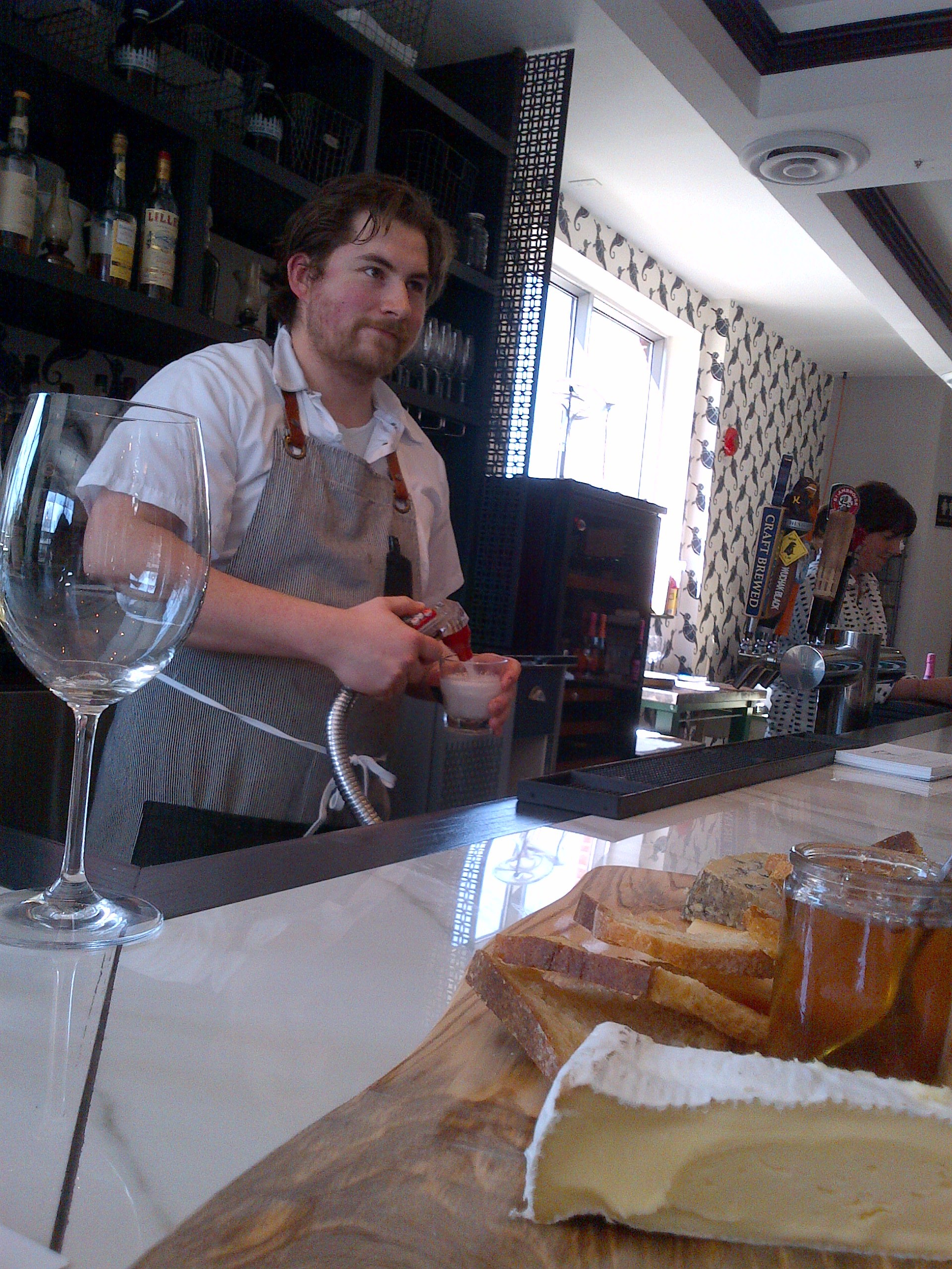 Steve Wall presenting his menu to the guests at Supply and Demand.